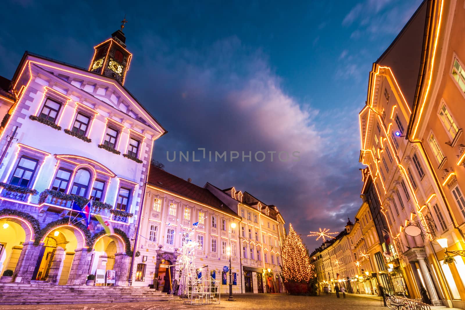 Romantic Ljubljana's city center, the capital of Slovenia, decorated for Christmas holidays. City Hall shot at dusk.