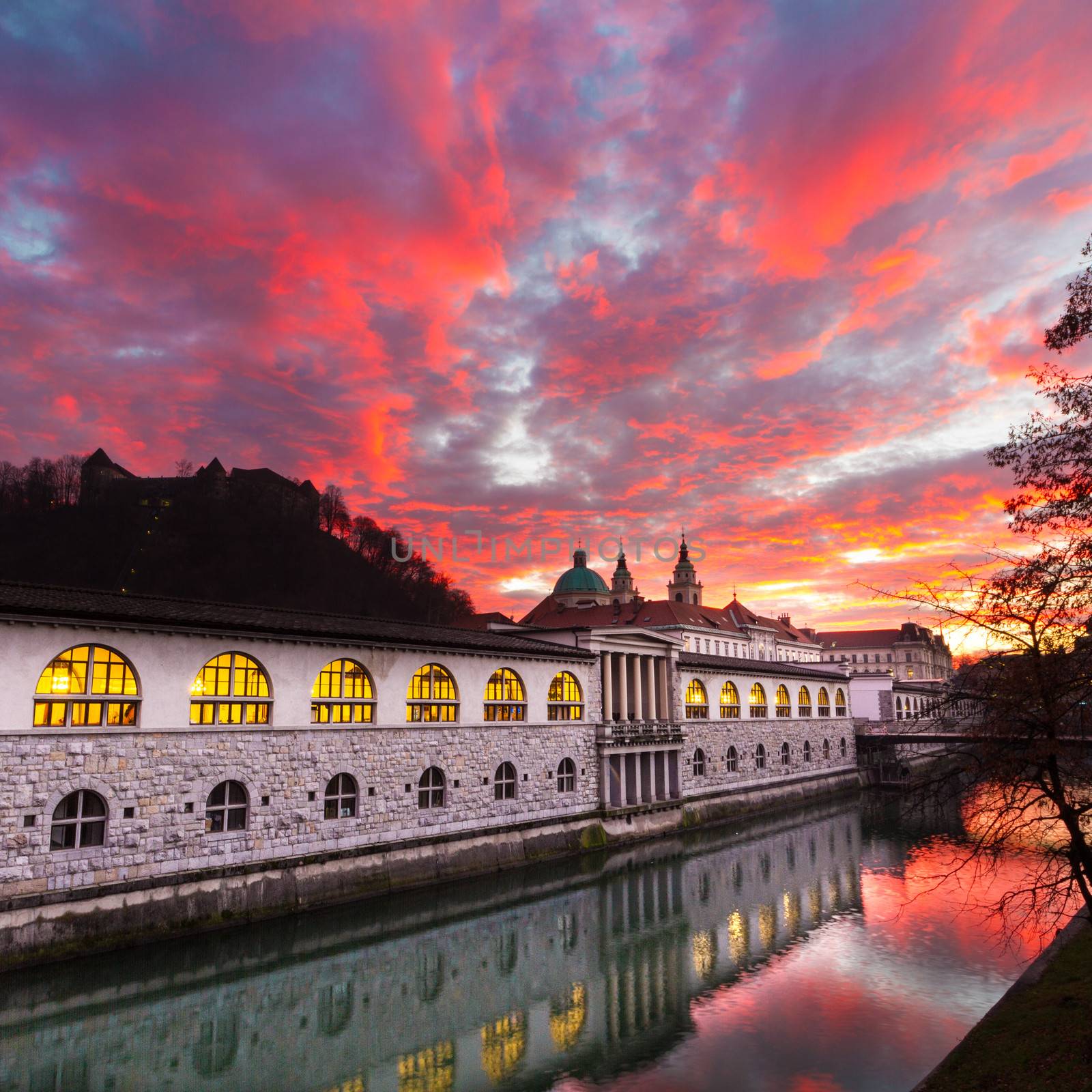 Ljubljana, Slovenia, Europe - Ljubljanica River and Central Market in sunset.  Ljubljana open market buildings was designed by famous architect Jo��e Plecnik.