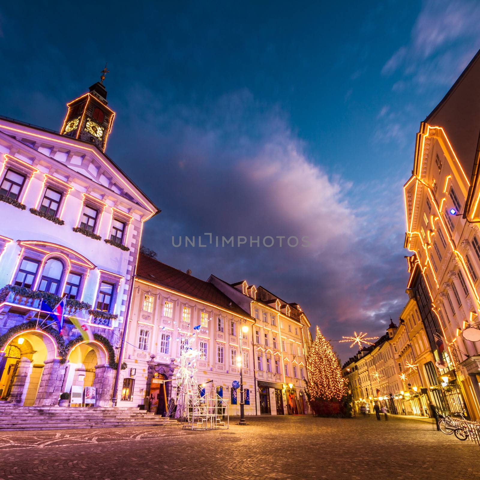 Romantic Ljubljana's city center, the capital of Slovenia, decorated for Christmas holidays. City Hall shot at dusk.