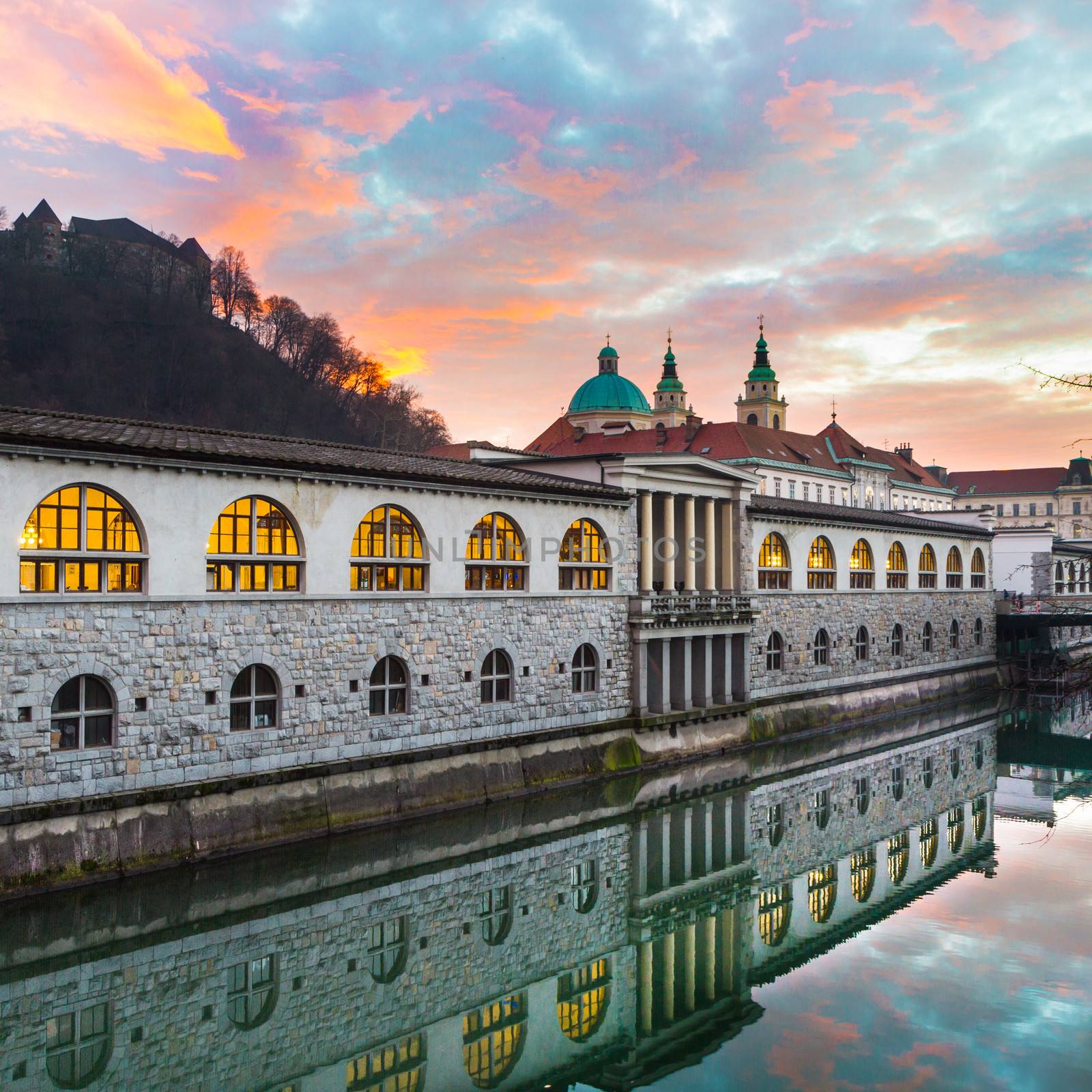 Ljubljana, Slovenia, Europe - Ljubljanica River and Central Market in sunset.  Ljubljana open market buildings was designed by famous architect Jo��e Plecnik.