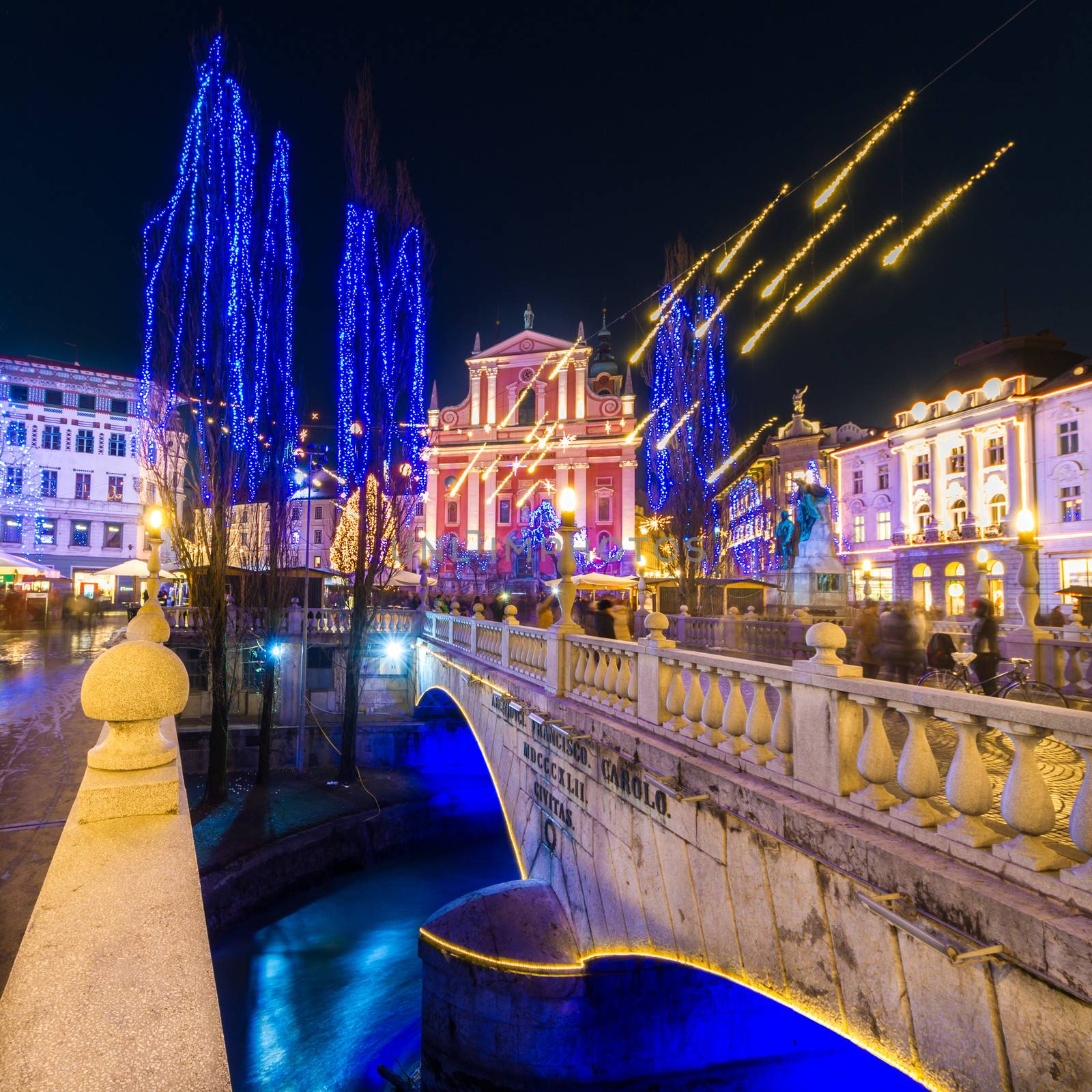Romantic Ljubljana's city center  decorated for Christmas time. River Ljubljanica, Triple Bridge (Tromostovje) and  Preseren's square; Ljubljana, Slovenia, Europe.