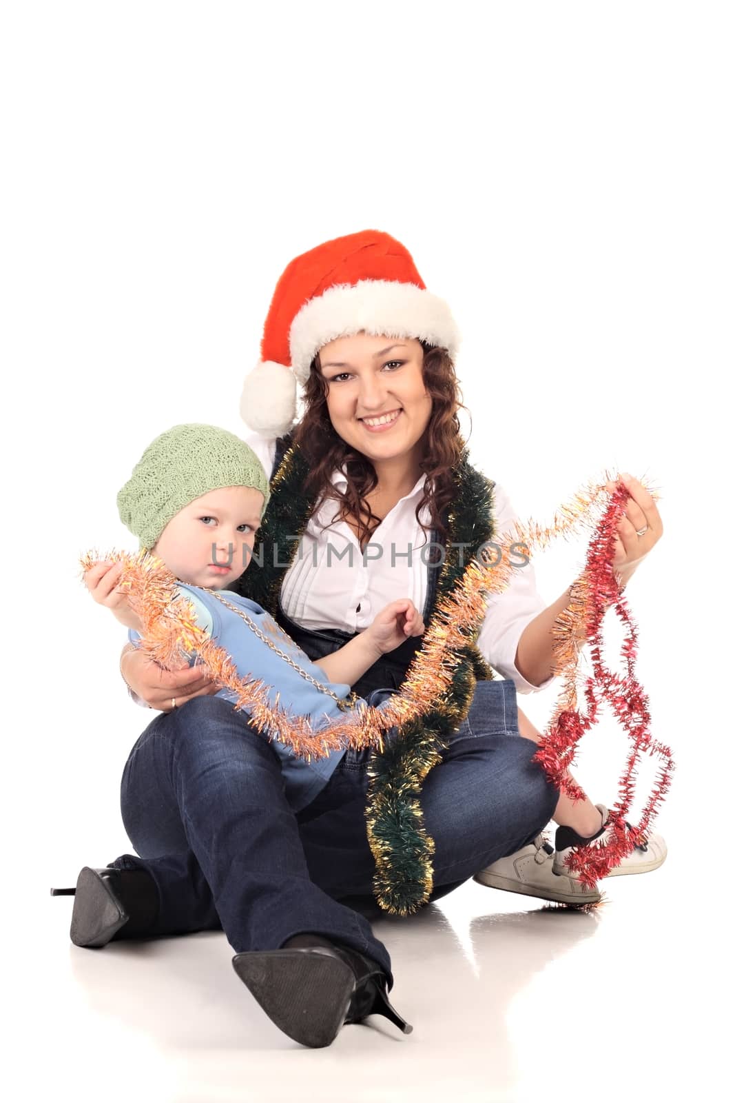 Girl in a santa hat with a little  boy by dedmorozz
