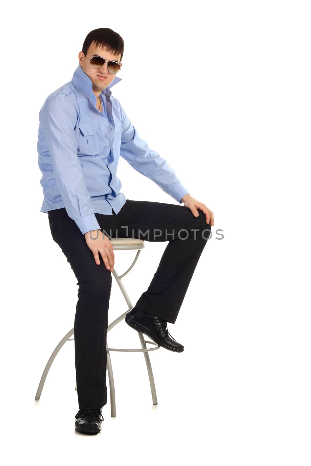 Funny guy sitting on the chair isolated on the white