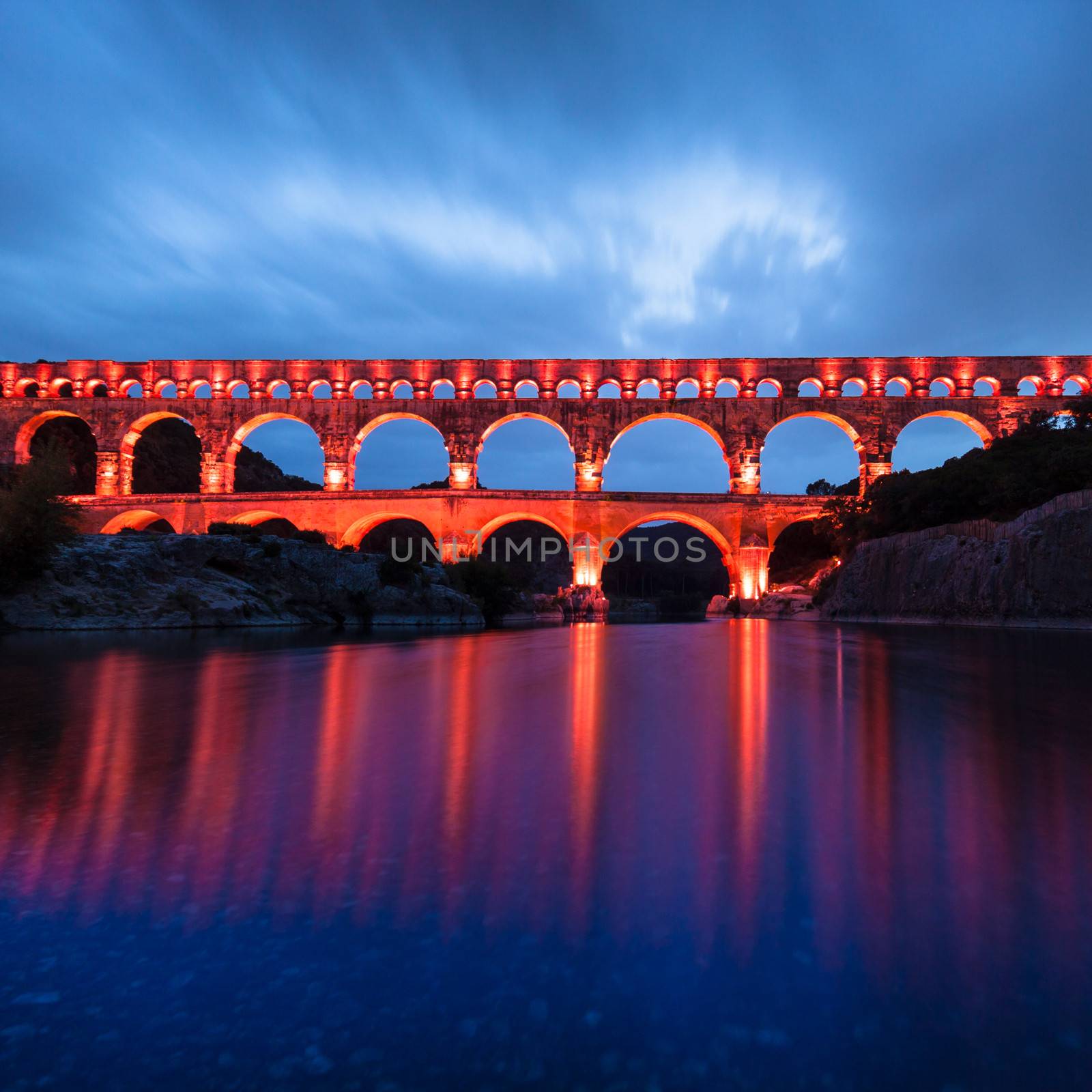 The Pont du Gard (Bridge of the Gard) is an ancient Roman aqueduct bridge that crosses the Gardon River in Vers-Pont-du-Gard near Remoulins, in the Gard d��partement of southern France, Europe.