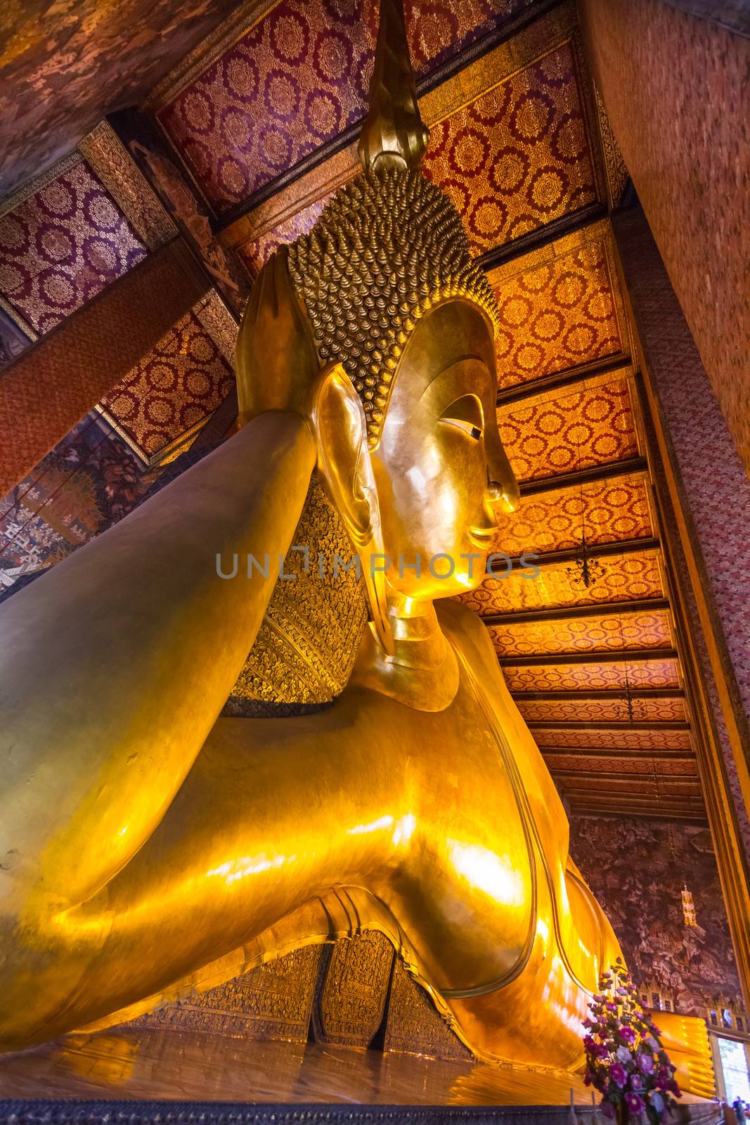 Reclining golden buddha in wat Pho temple, Bangkok, Thailand.