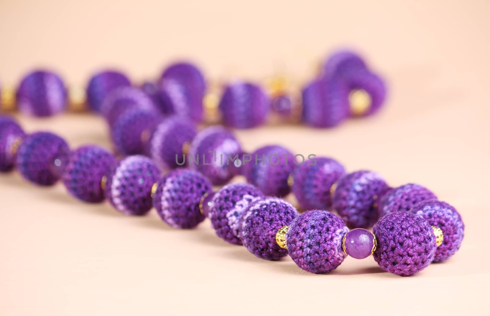 Violet beads at pink background
