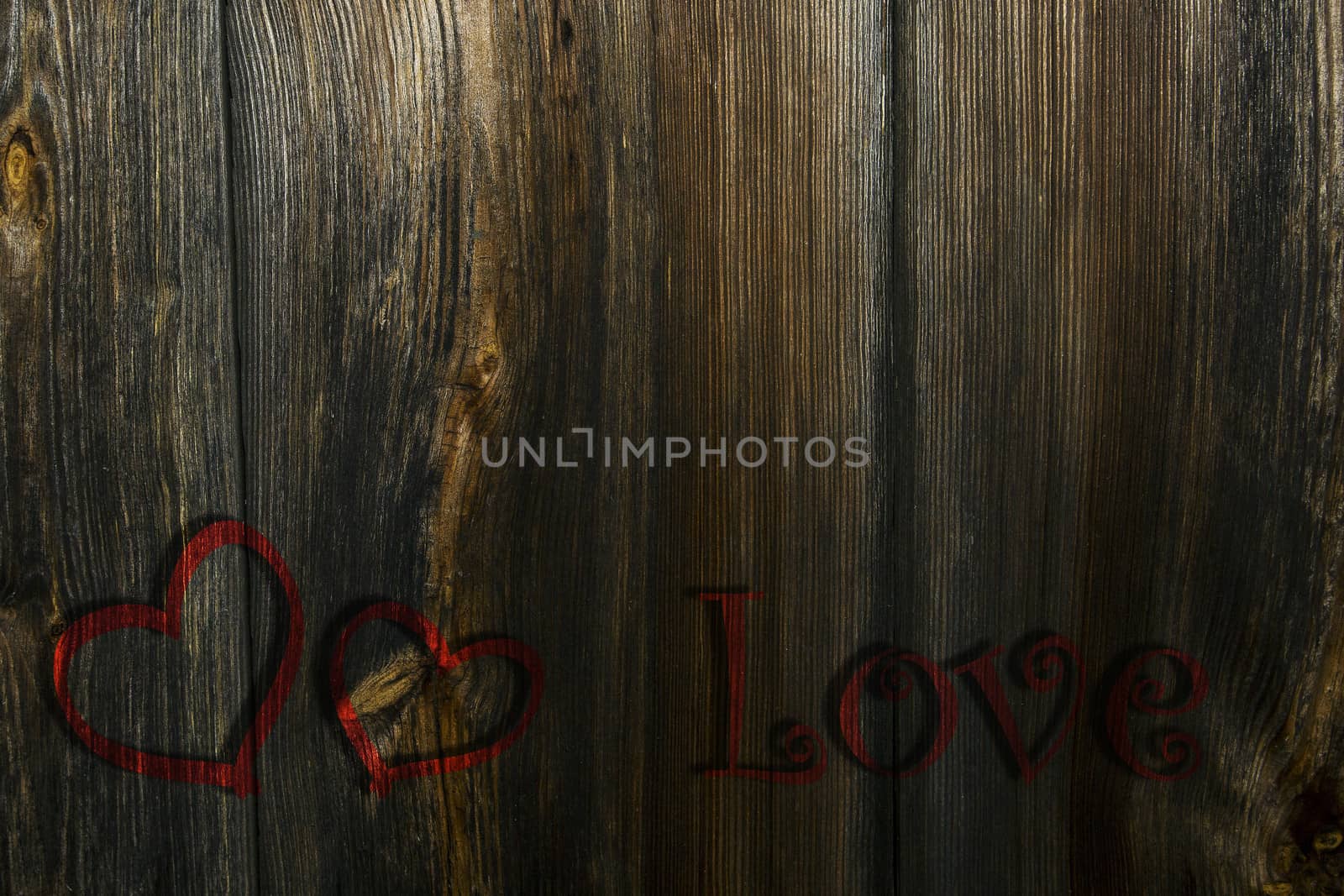 Two red hearts and the inscription on the wooden background, a Valentines theme.