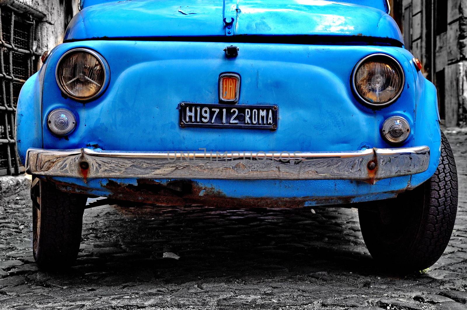 ROME - SEPTEMBER 20: A Fiat 500 on September 20, 2013 in Rome. Fiat 500 was produced by the Fiat company from 1957 to 75. Taken in Rome, Italy on September 20, 2013