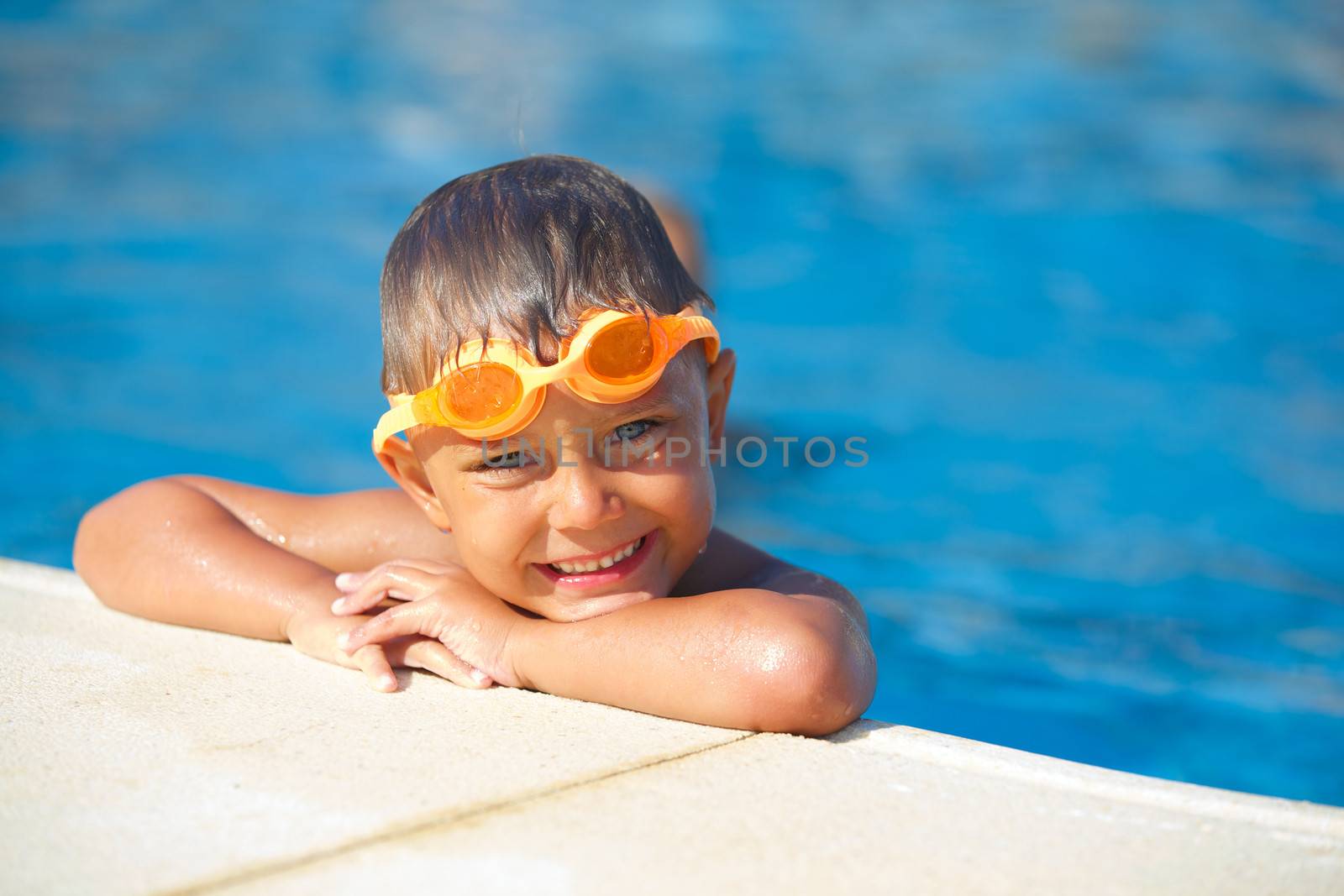 Activities on the pool. Cute boy in swimming pool