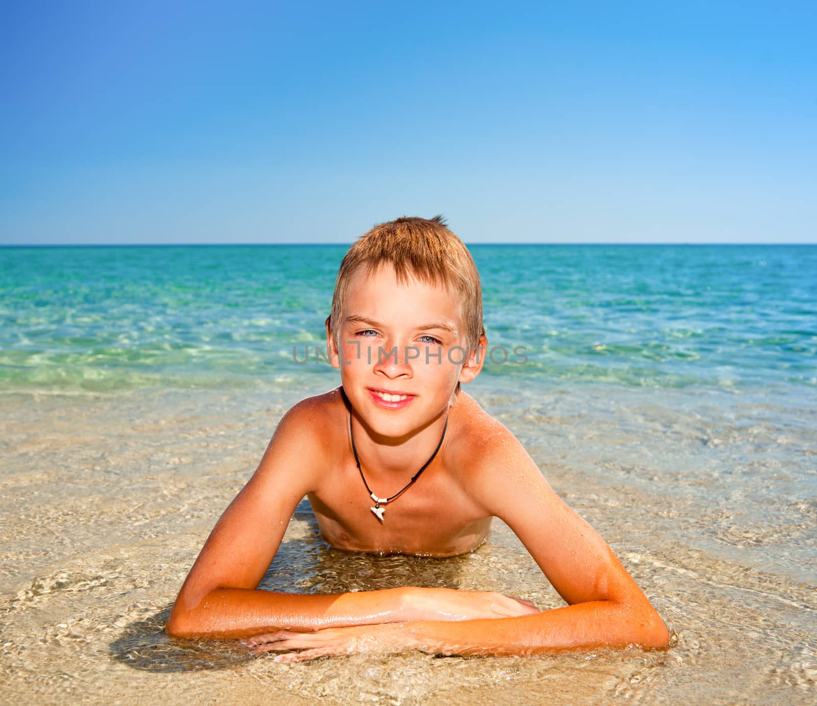 Boy on a beach by naumoid