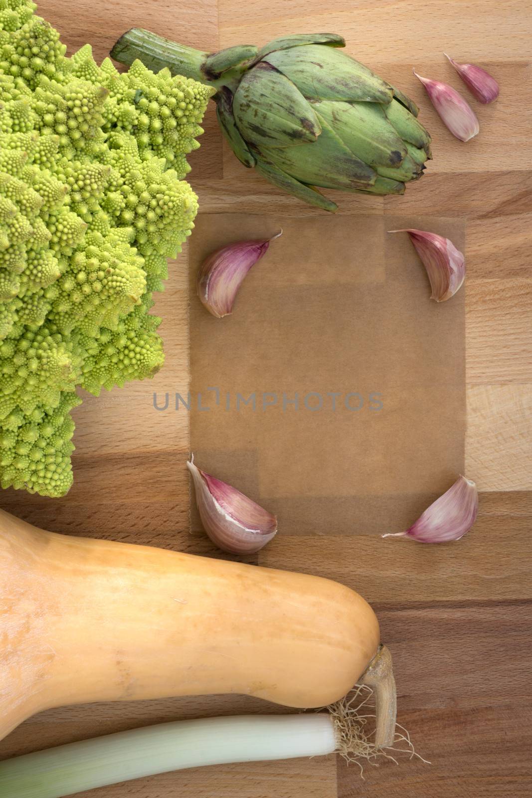 Vegetables background with a paper for notes