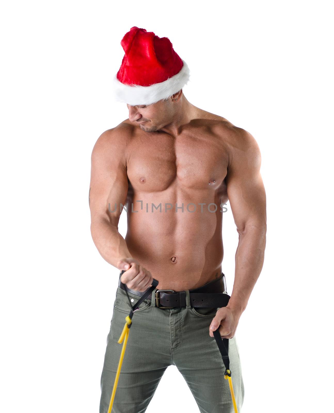 Sexy muscular Santa Claus shirtless, working out, looking at his own muscles