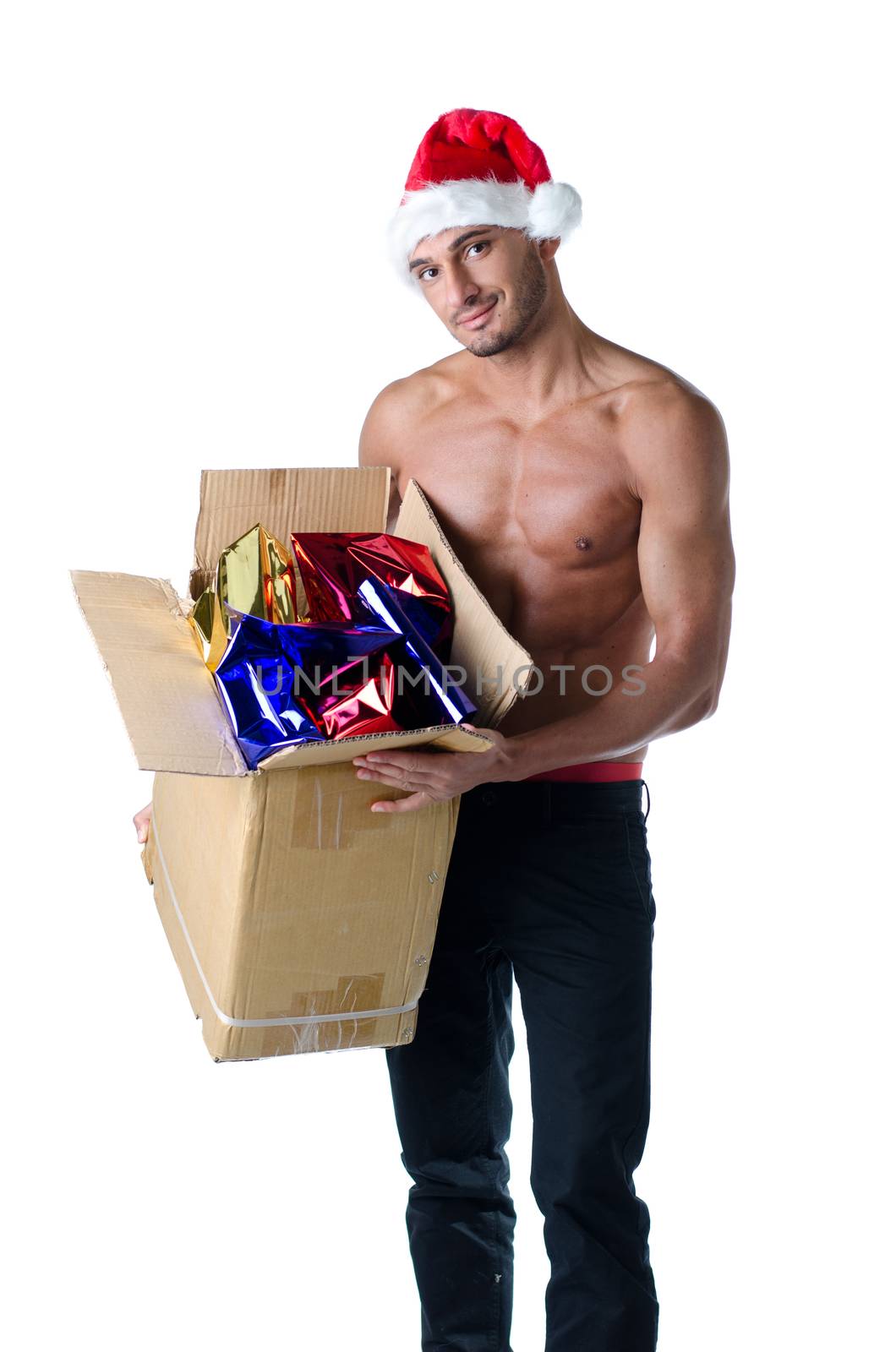 Athletic, young, shirtless Santa Claus with cardboard box full of presents, smiling