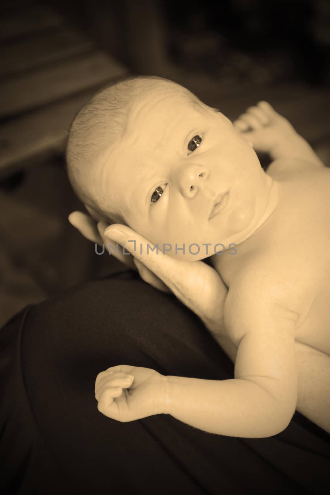 newborn baby with mom in sepia