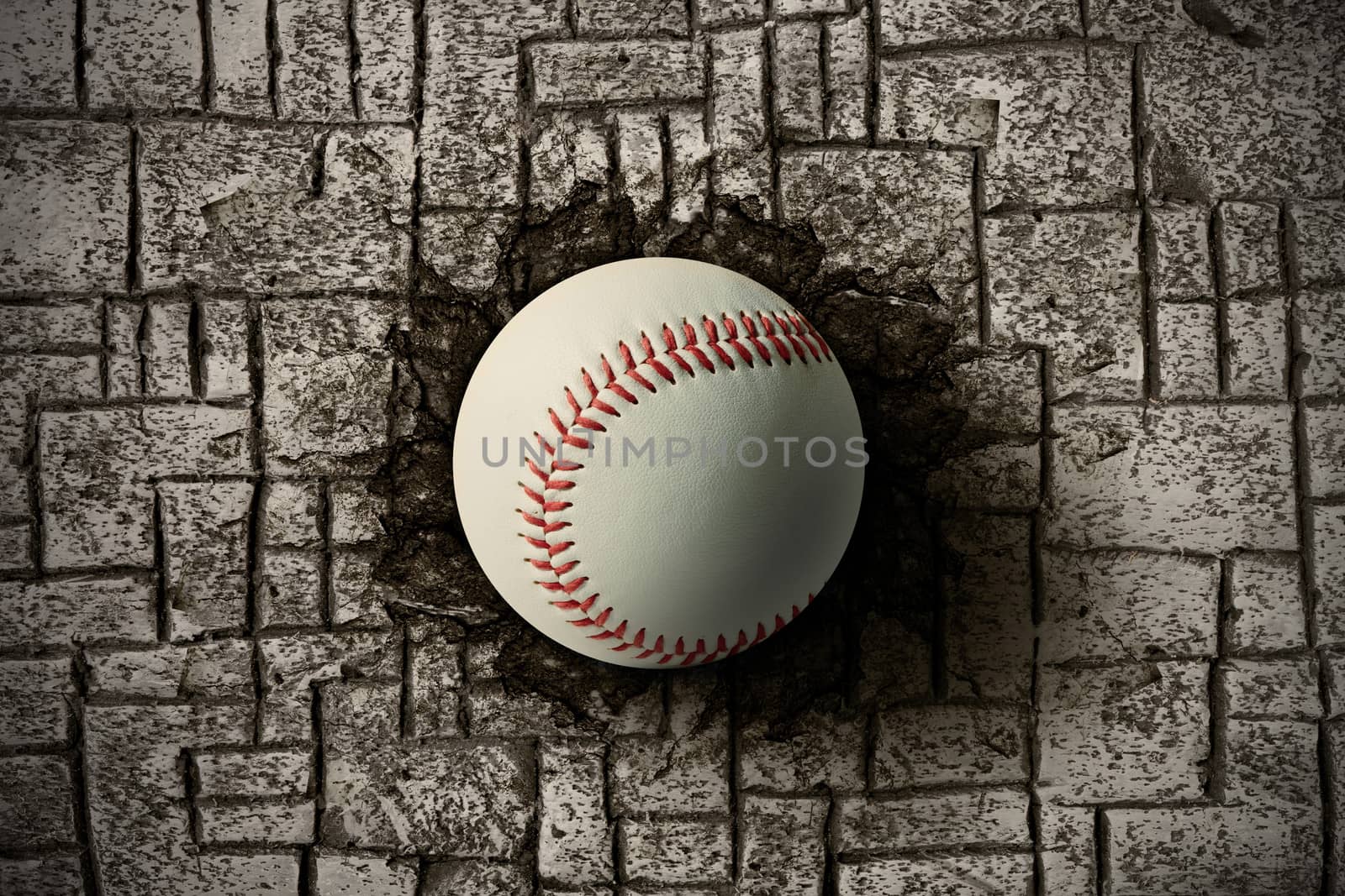 baseball ball embedded in a brick wall