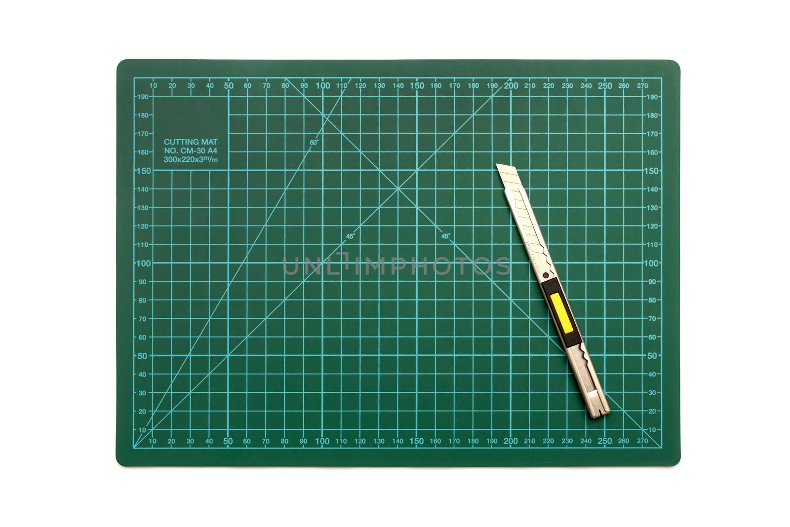 green cutting mat on a white background