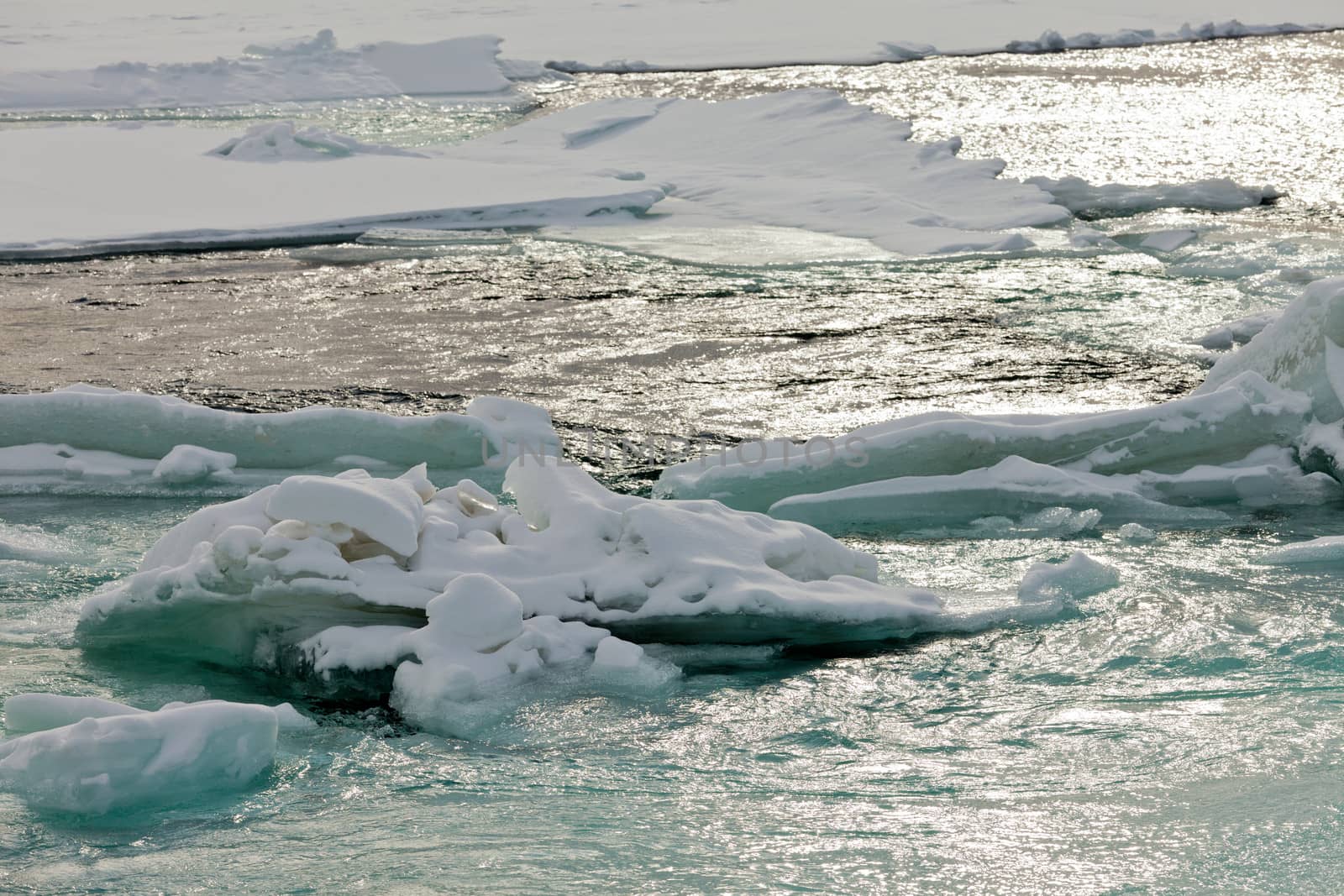 Flowing open river water jammed ice floes abstract by PiLens