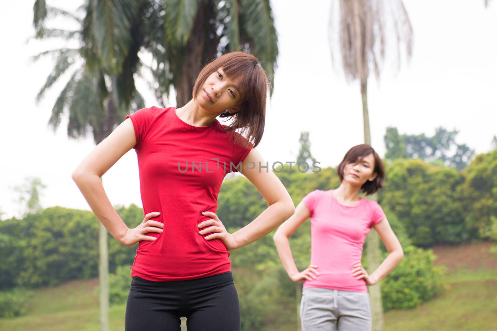 Asian Chinese woman workout outdoor, stretching