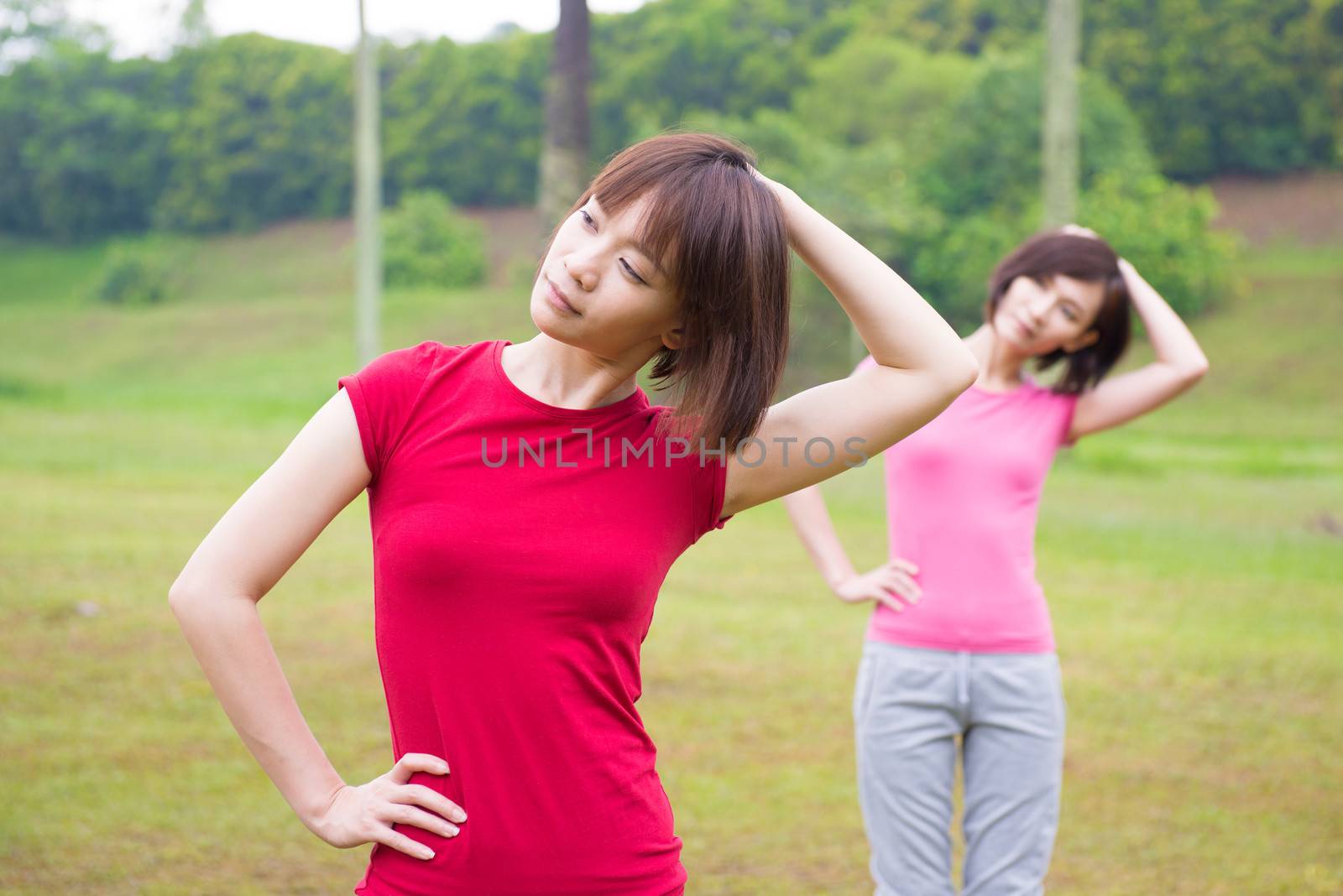 Asian Chinese girls workout outdoor, stretching