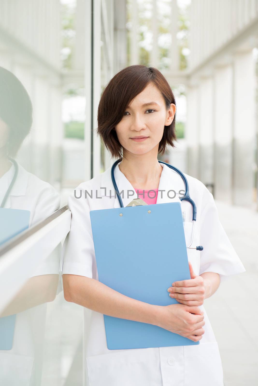 Portrait of Asian Chinese medical people at the hospital corridor.