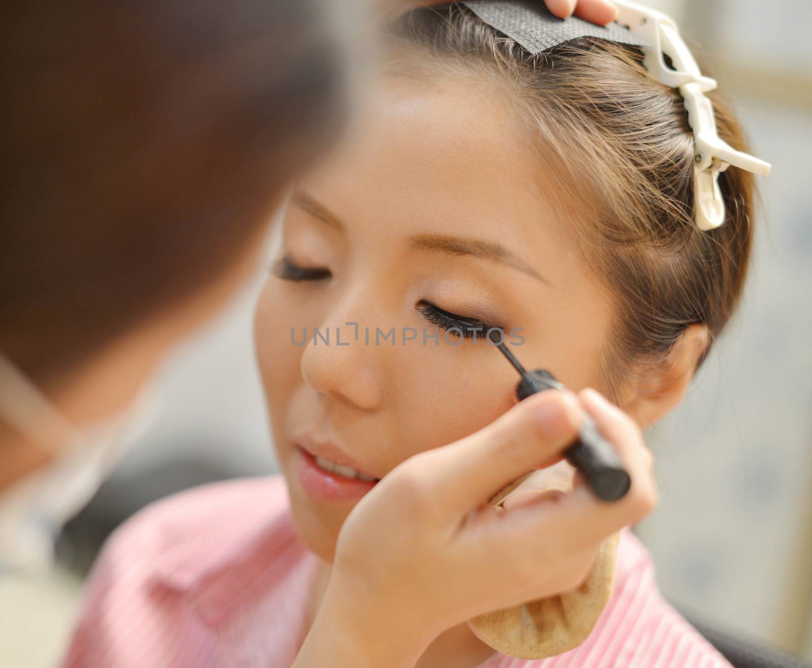 Asian Chinese bridal make up candid shoot. Wedding makeover preparation.