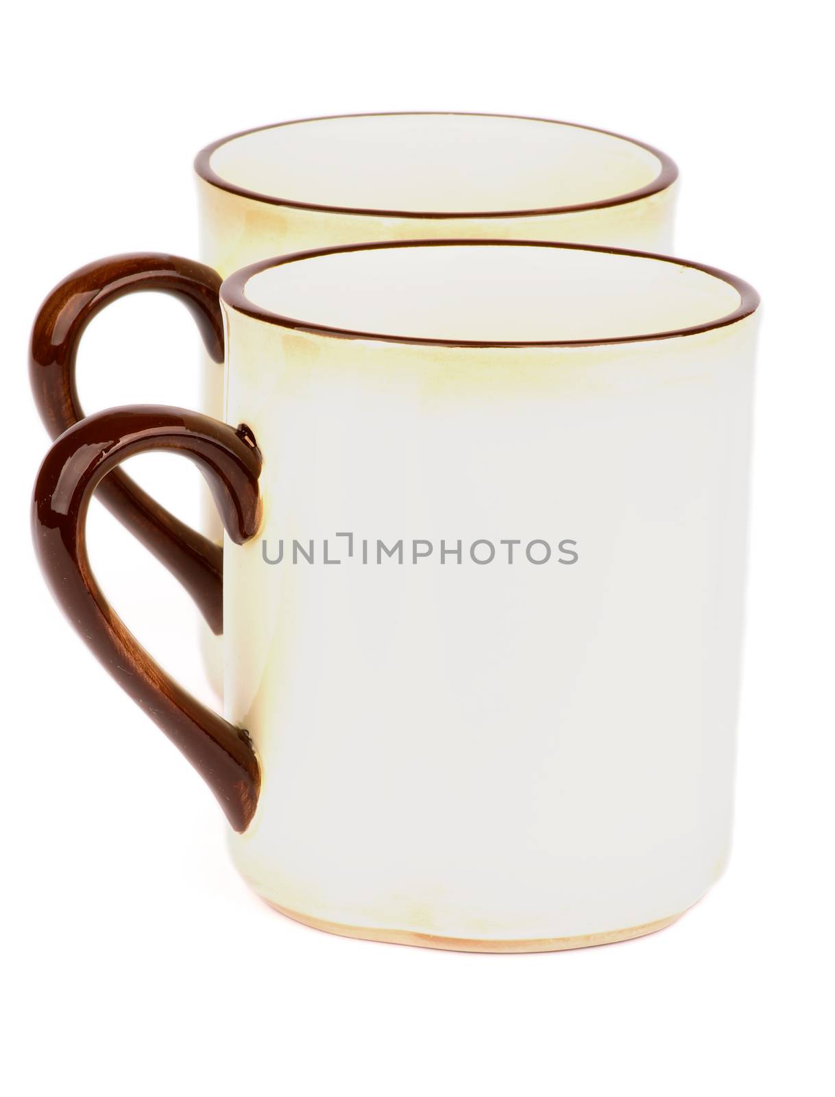 Pair of Beige Tea Cups with Brown Handles isolated on white background