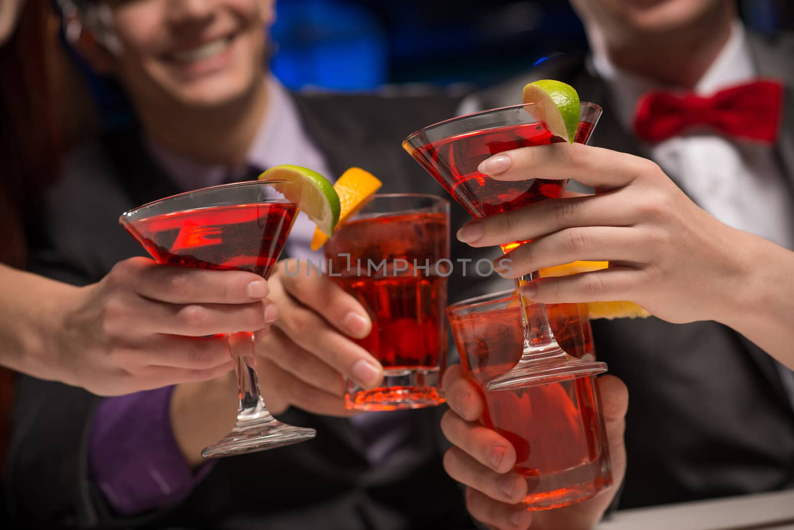 close-up of hands with glasses, a toast, party with friends