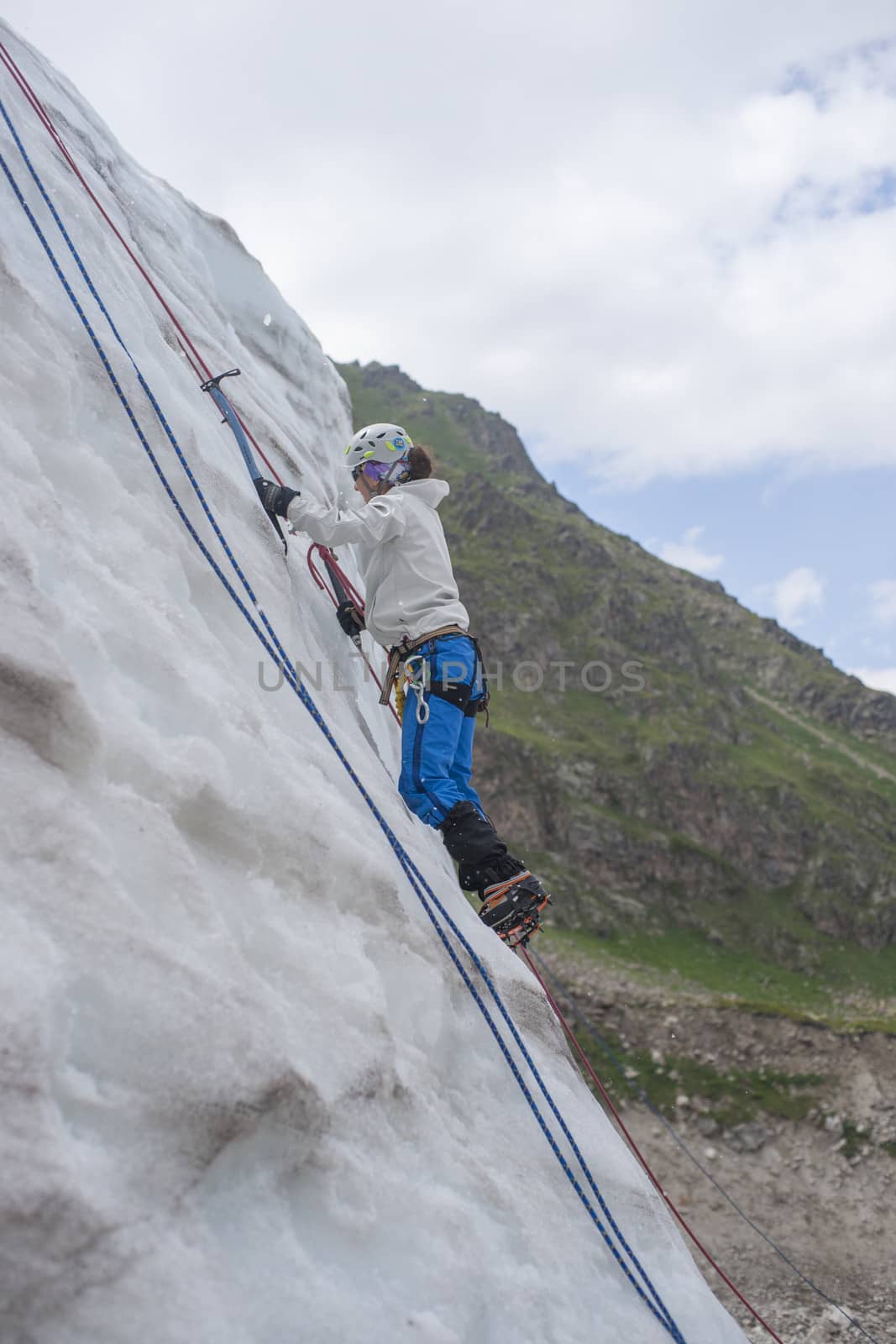 Girl climb up on the ice by kozak