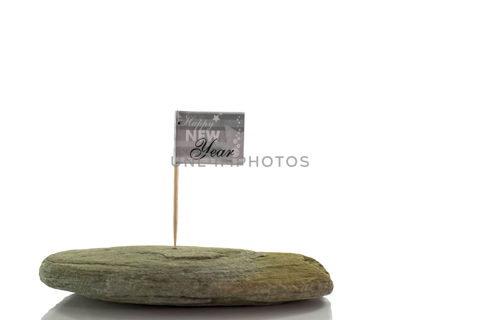 happy new year flag on solid rock isolated on white