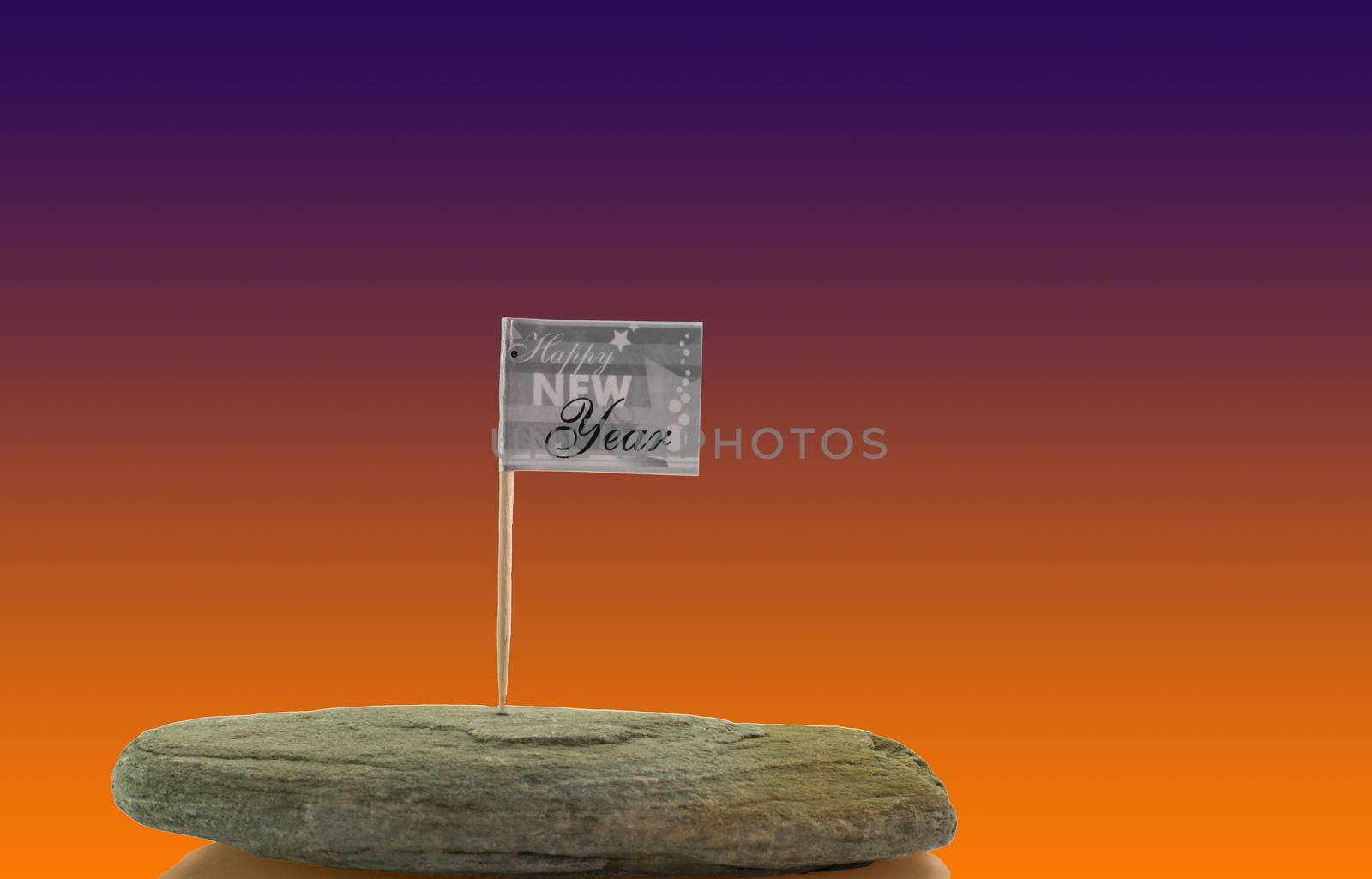 happy new year flag on solid rock isolated on white