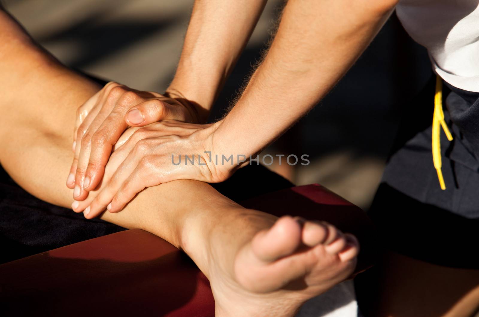 Therapist giving a leg massage