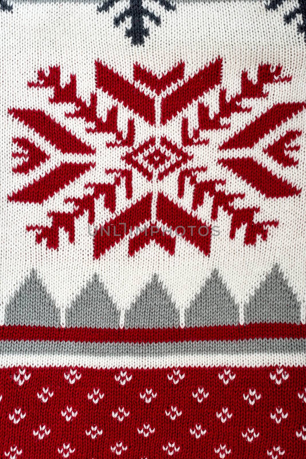 Knitted background with Christmas ornament