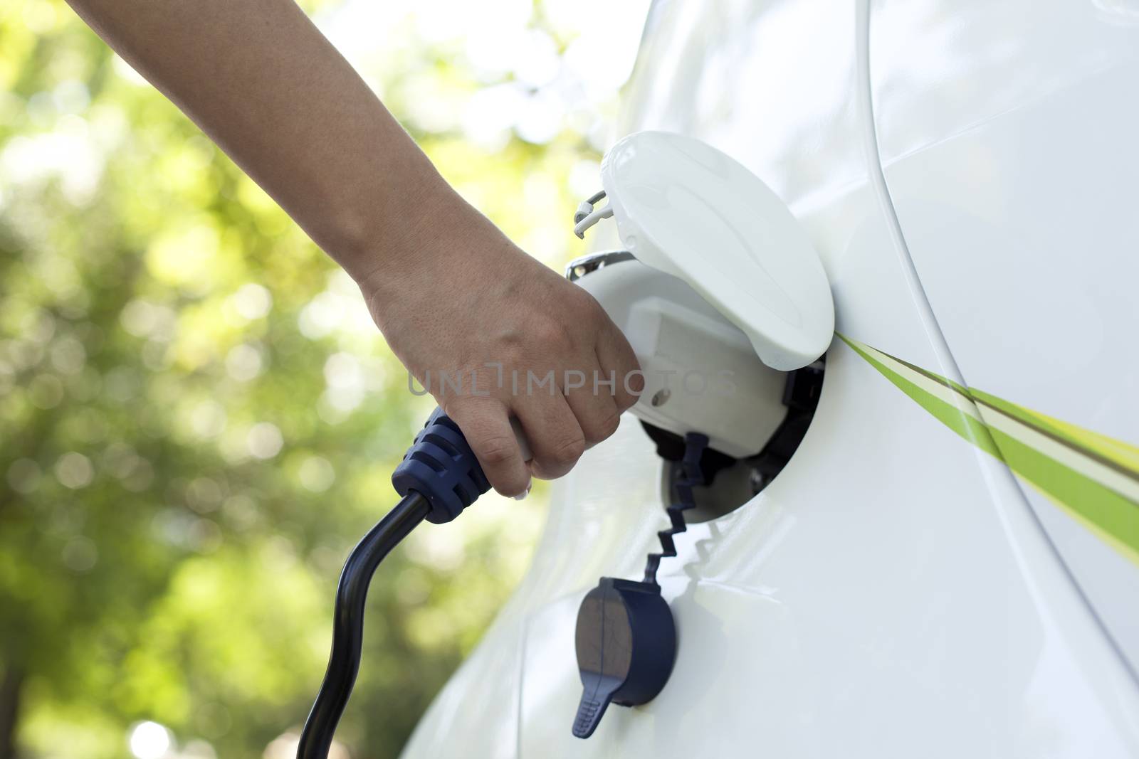 Charging of an electric car by wellphoto