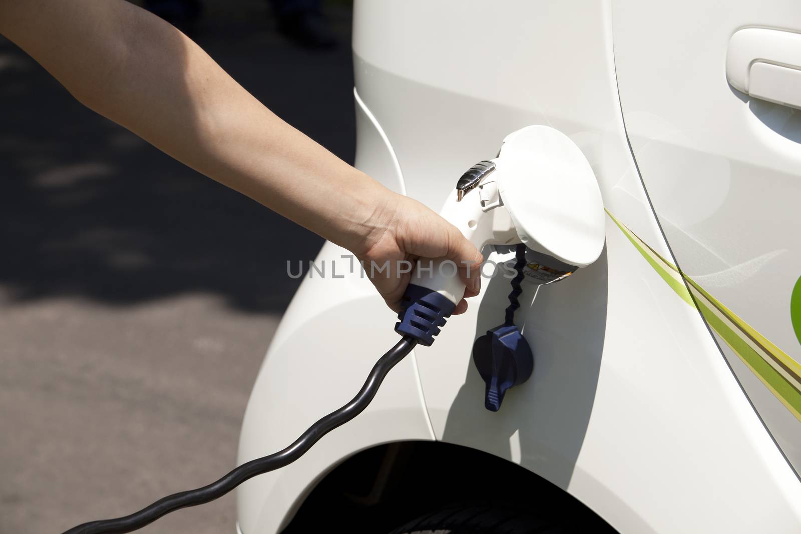 Charging of an electric car by wellphoto