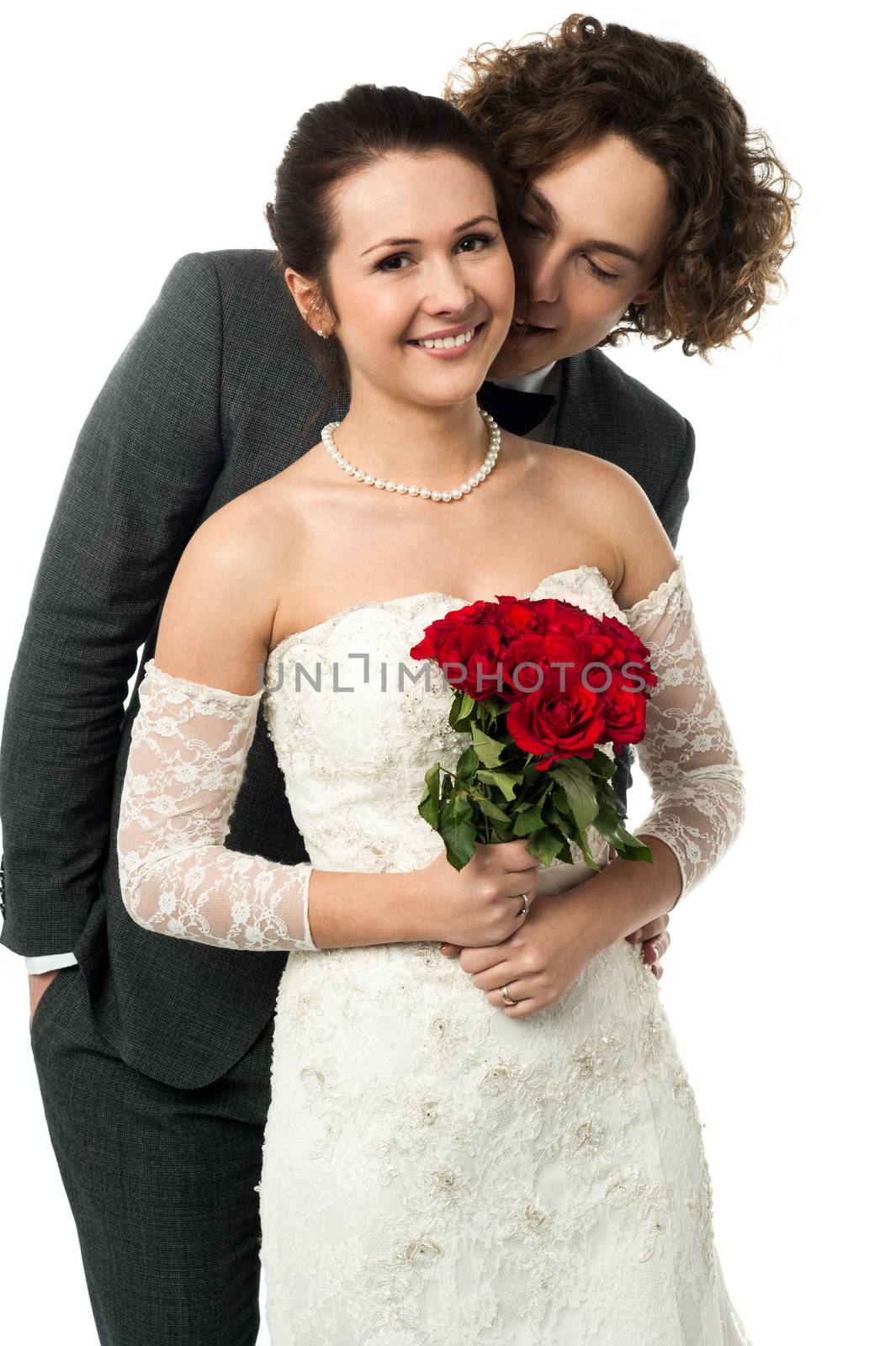 Man whispering into the ears of a bride