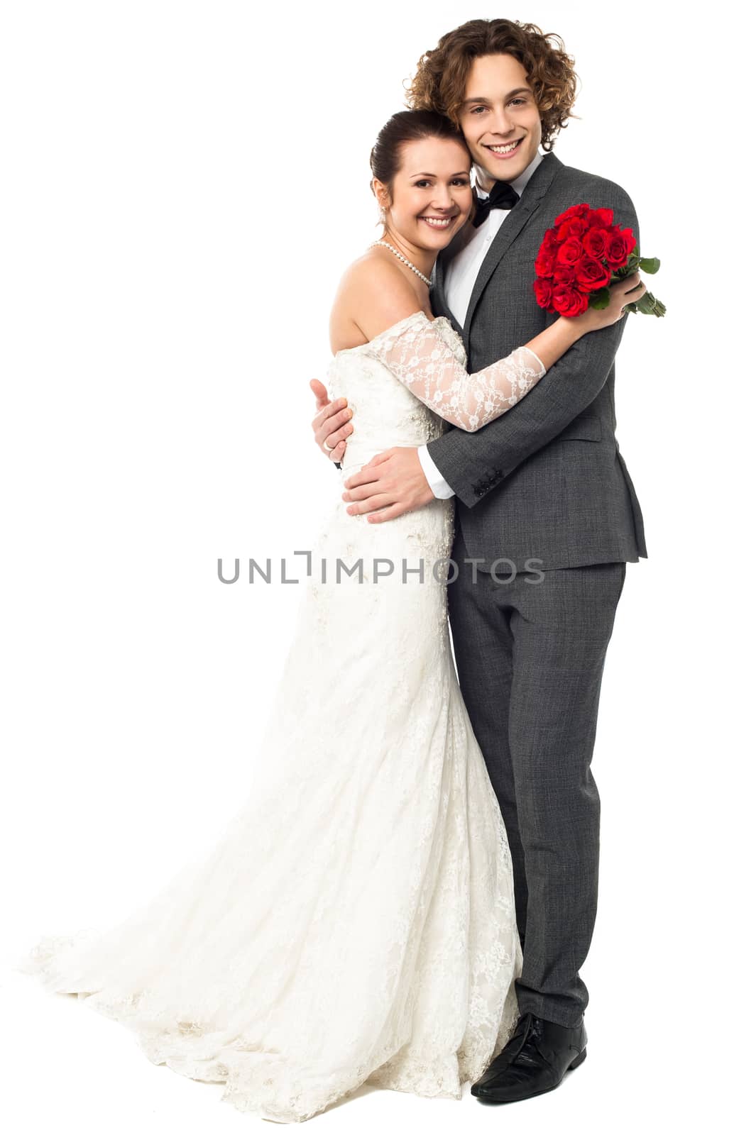 Lovely young married couple embracing warmly by stockyimages