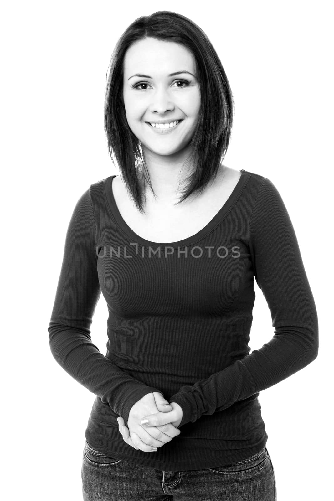 Smiling girl posing with clasped hands by stockyimages