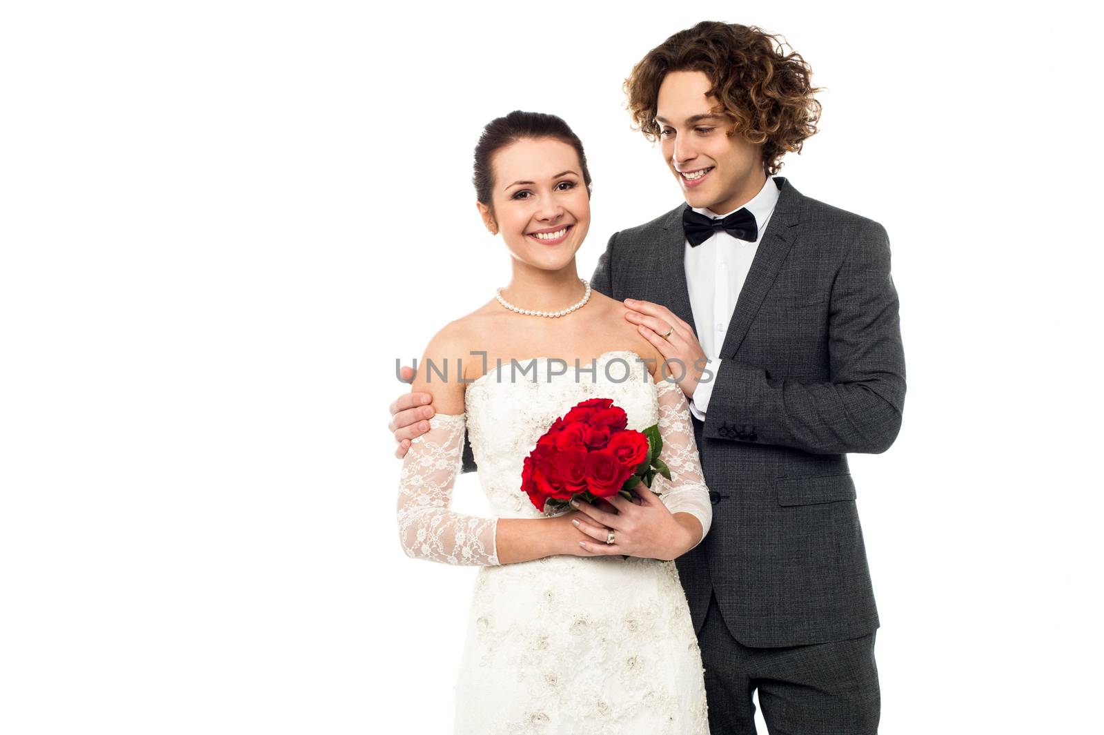 Lovely young newlyweds by stockyimages