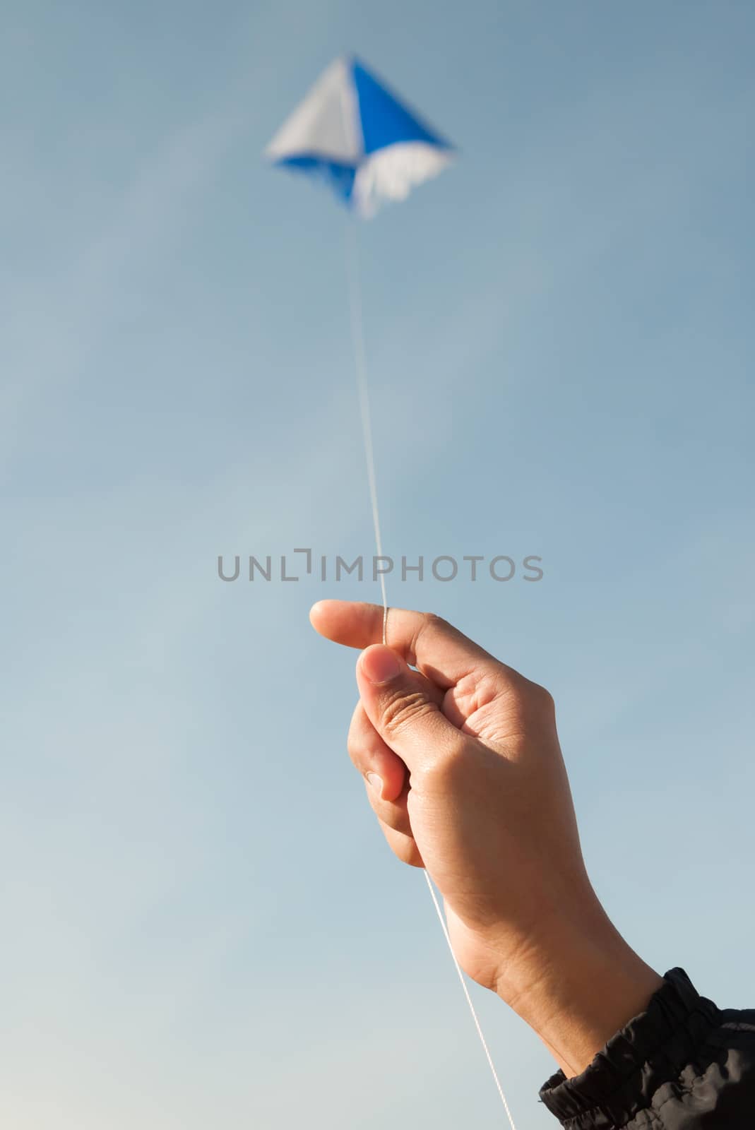kite flying in a blue sky and clouds