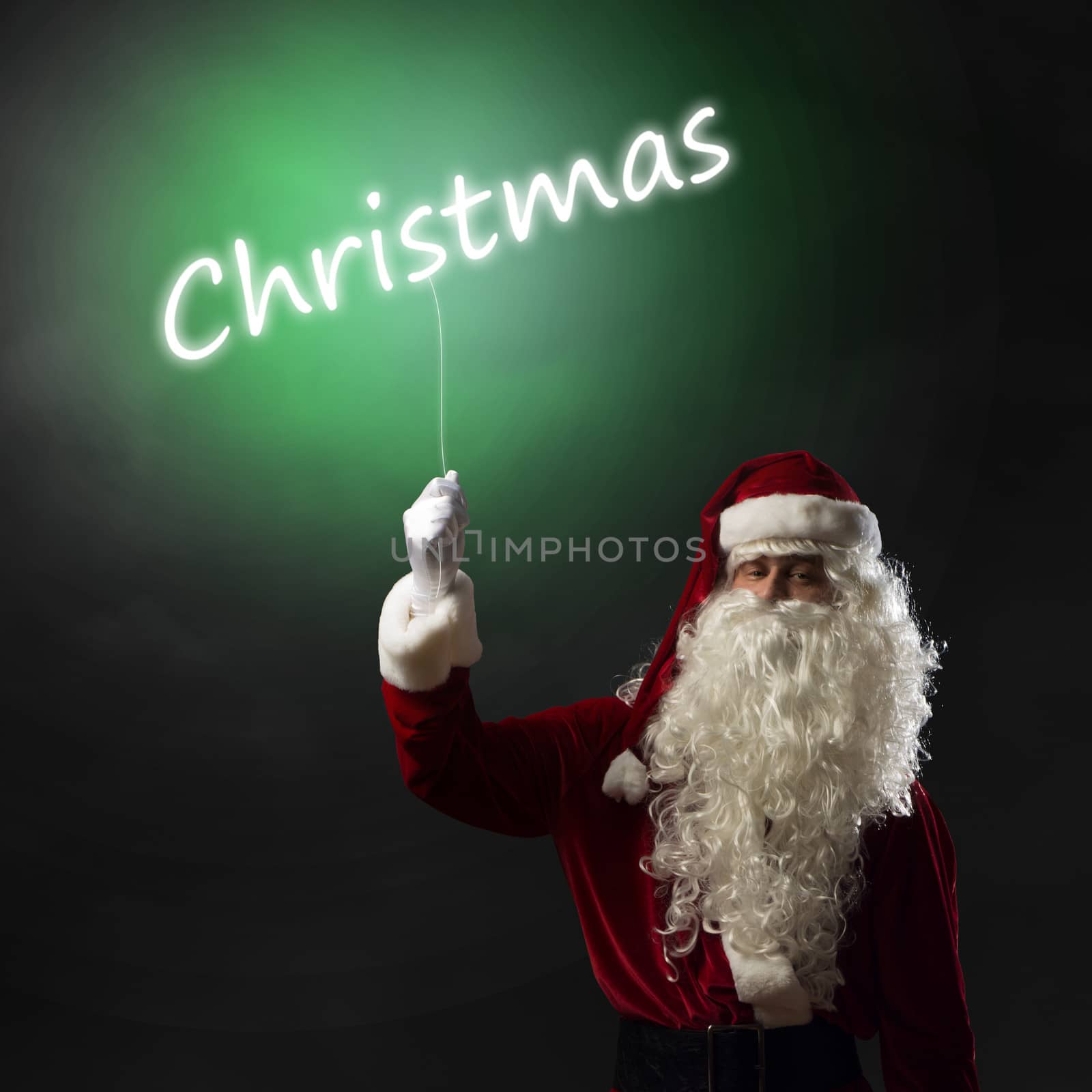 Santa Claus holding a shining light christmas word for thread