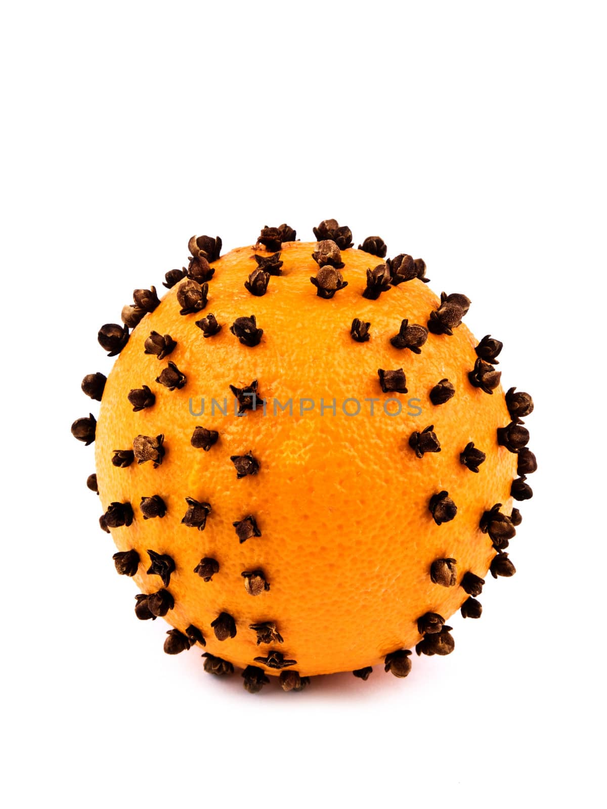 Aromatic Christmas orange with cloves on white background