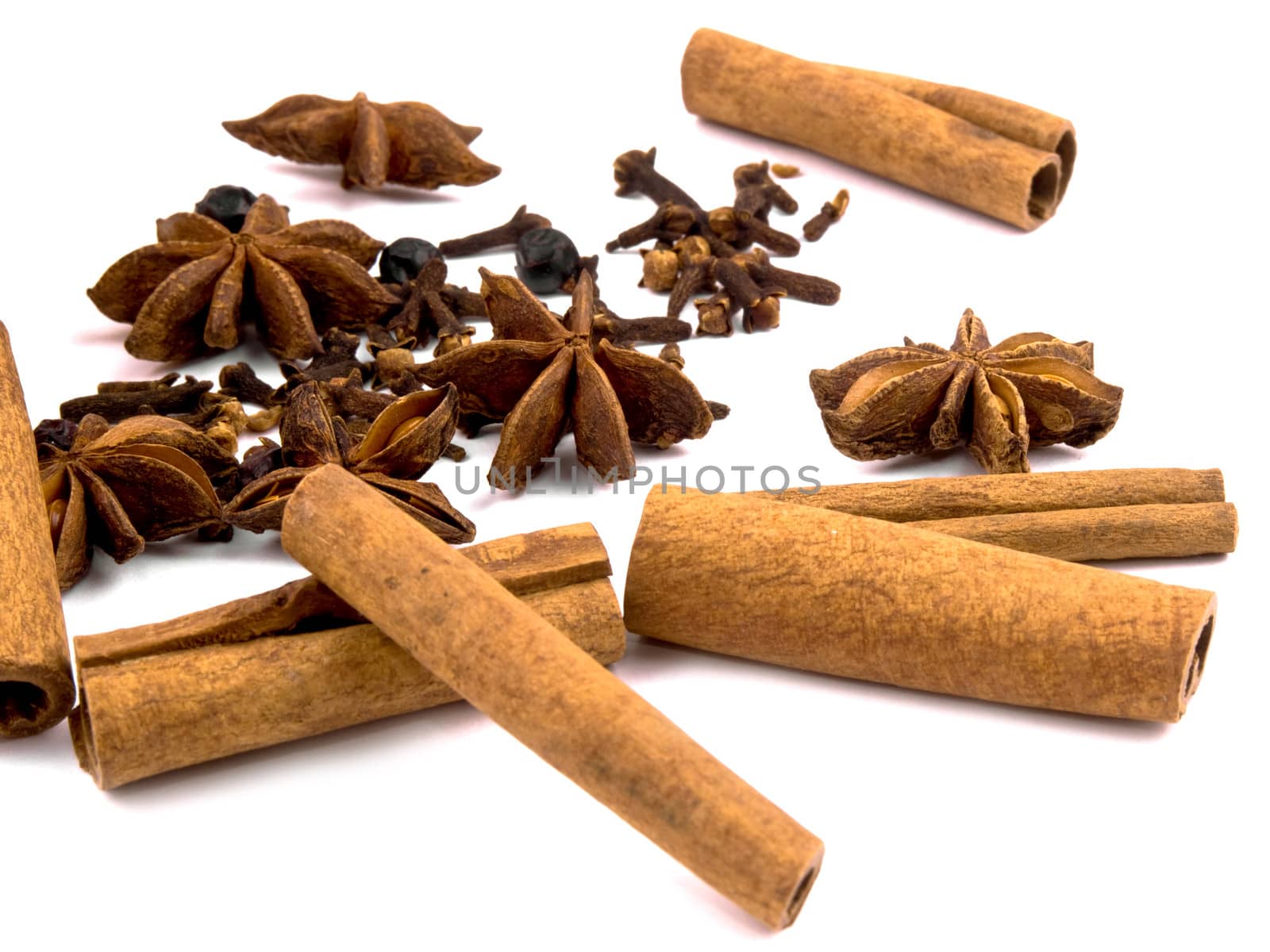 Closeup picture of aromatic Christmas spices on white background