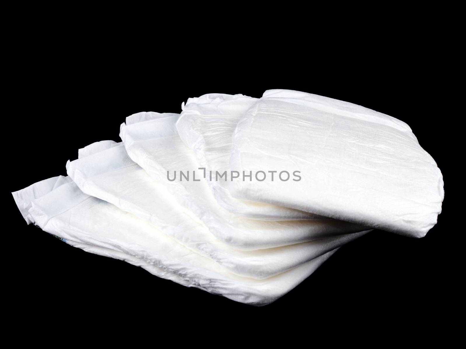 Stock of white diapers on black by mrsNstudio