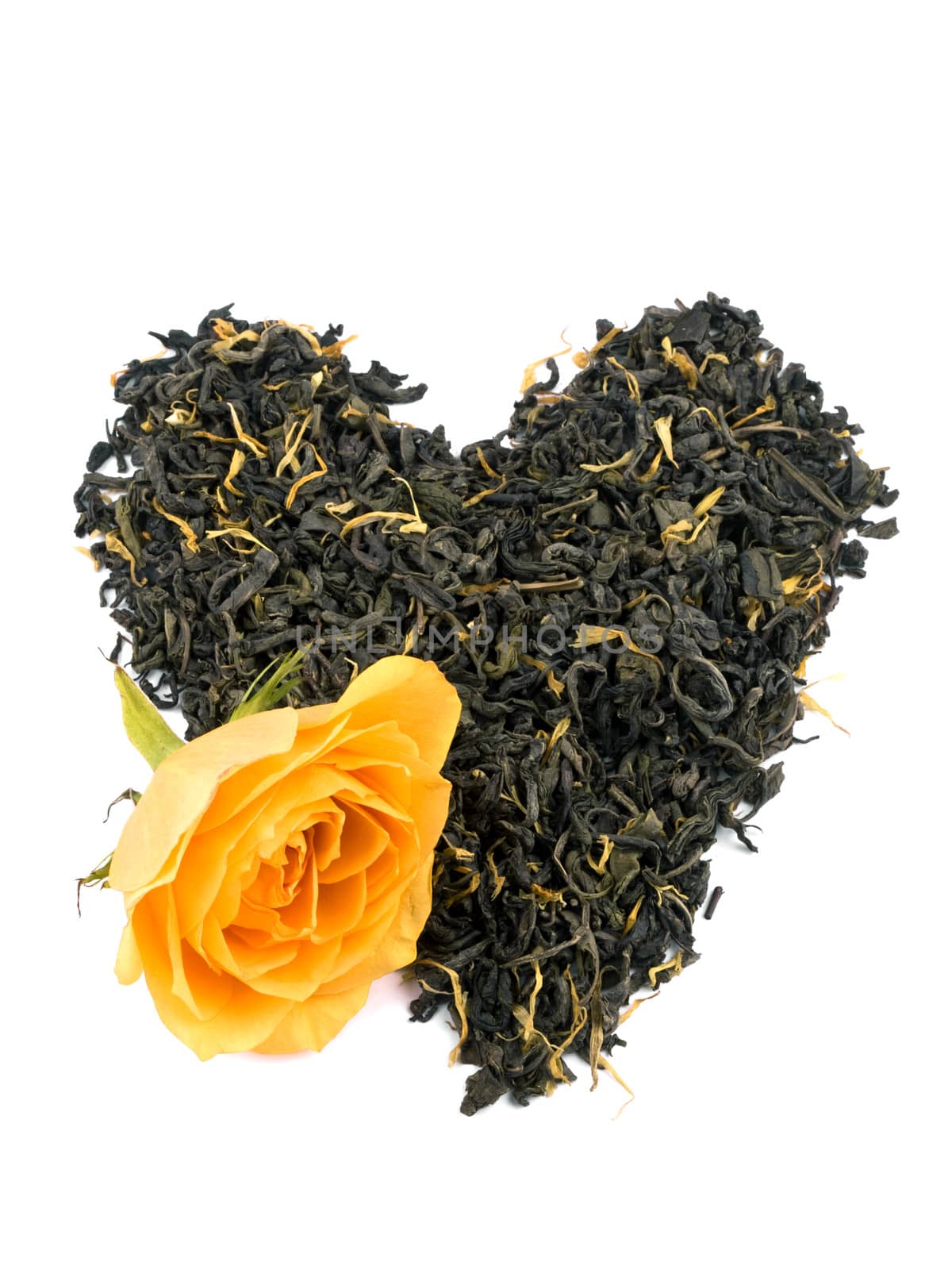 Aromatic green tea leaves with marigold petals formed on heart on white background