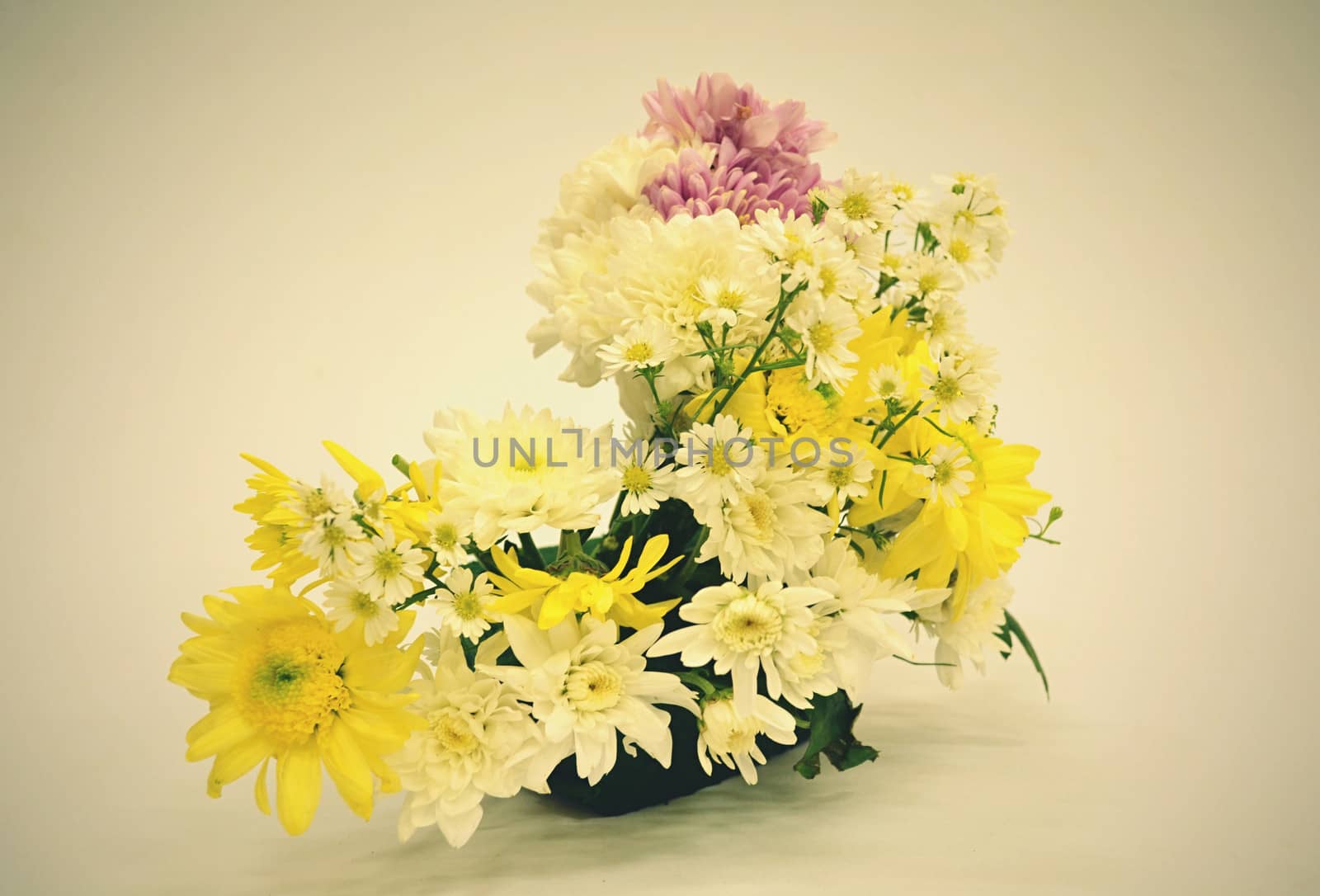 Bouquet of Flowers in a Glass on Vintage background