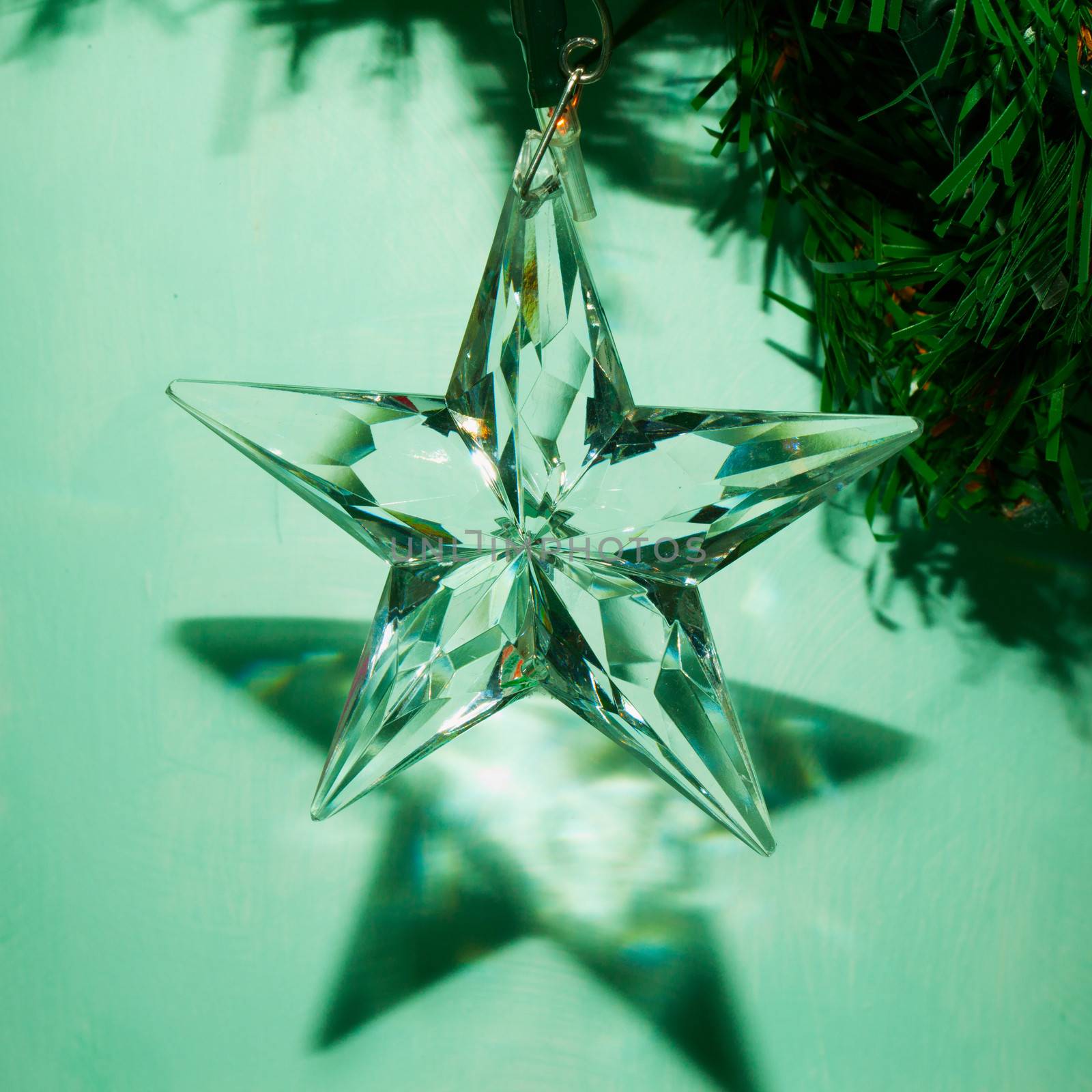 Crystal star pending from a Christmas tree