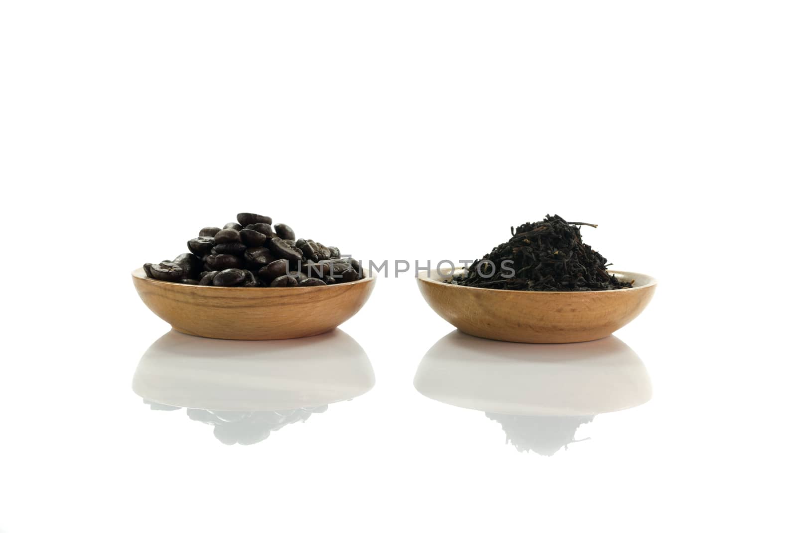 coffee beans and  tea leaves isolated on white
