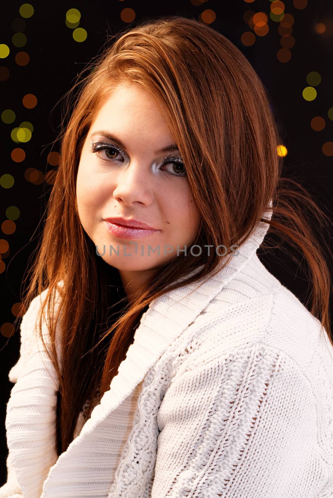 Friendly smiling young woman portrait studio shot