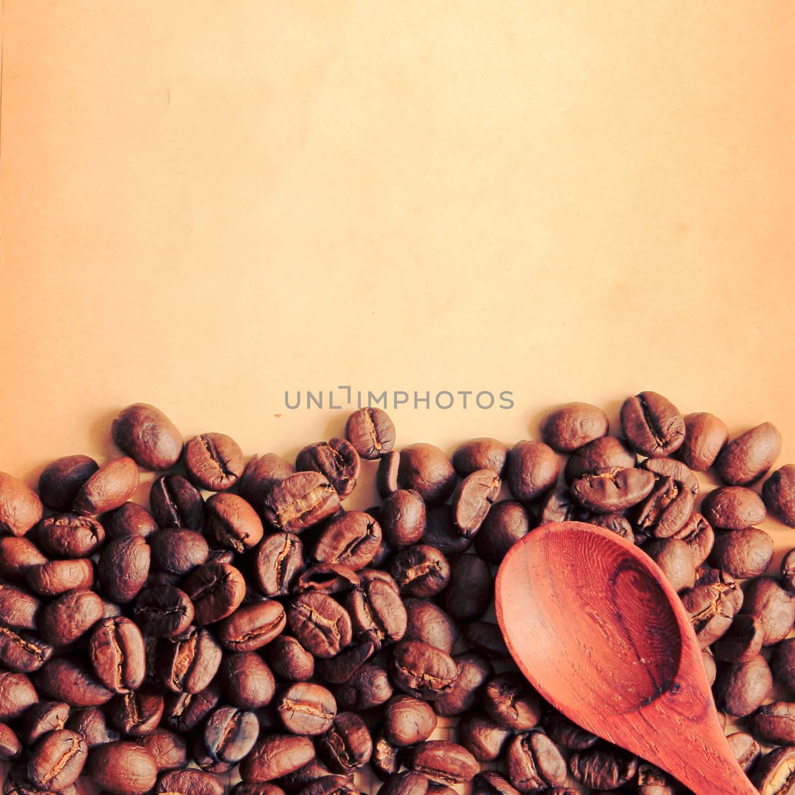 Coffee beans and spoon with old paper, retro filter effect