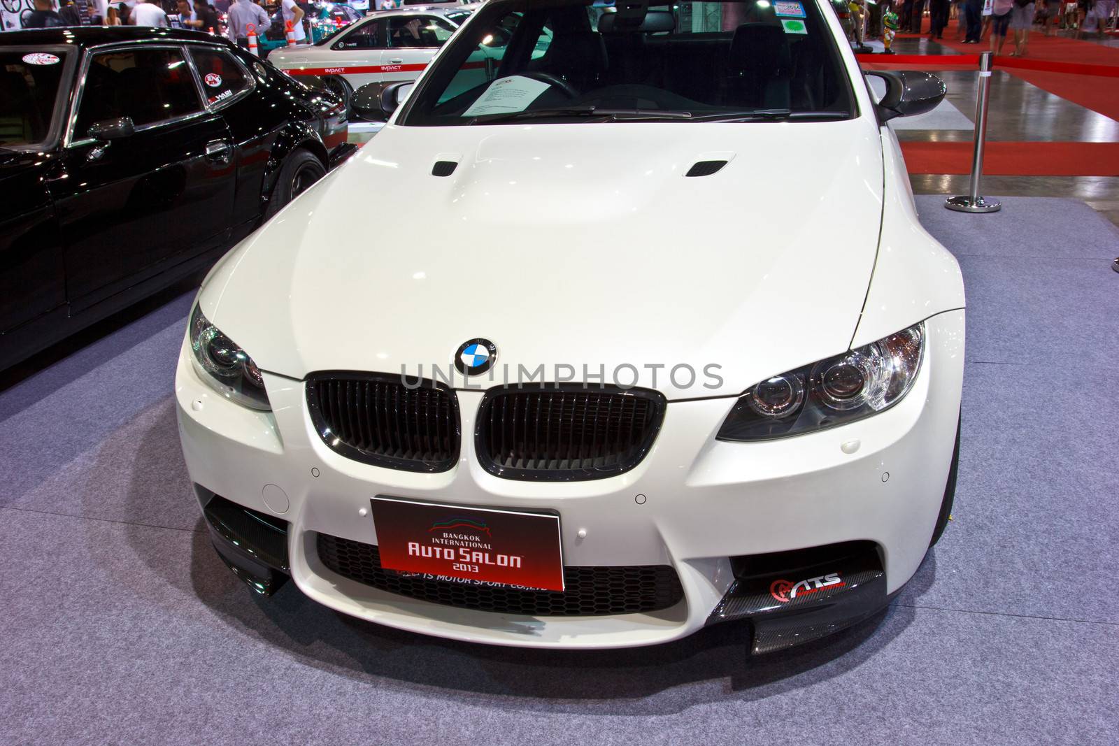 BANGKOK - JUNE 23 : White BMW show at show at The second Bangkok International Auto Salon 2013, the largest and most magnificent Modified Car and automobile accessories show in Bangkok, Thailand.